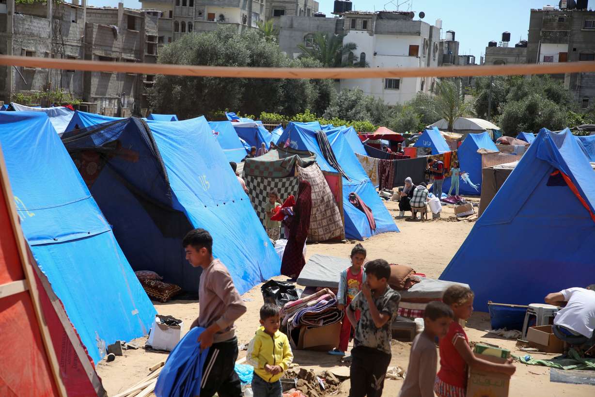 Displaced people look on after the Israeli military began evacuating Palestinian civilians ahead of a threatened assault on Rafah, amid the ongoing conflict between Israel and Hamas, in Rafah, in the southern Gaza Strip Monday.