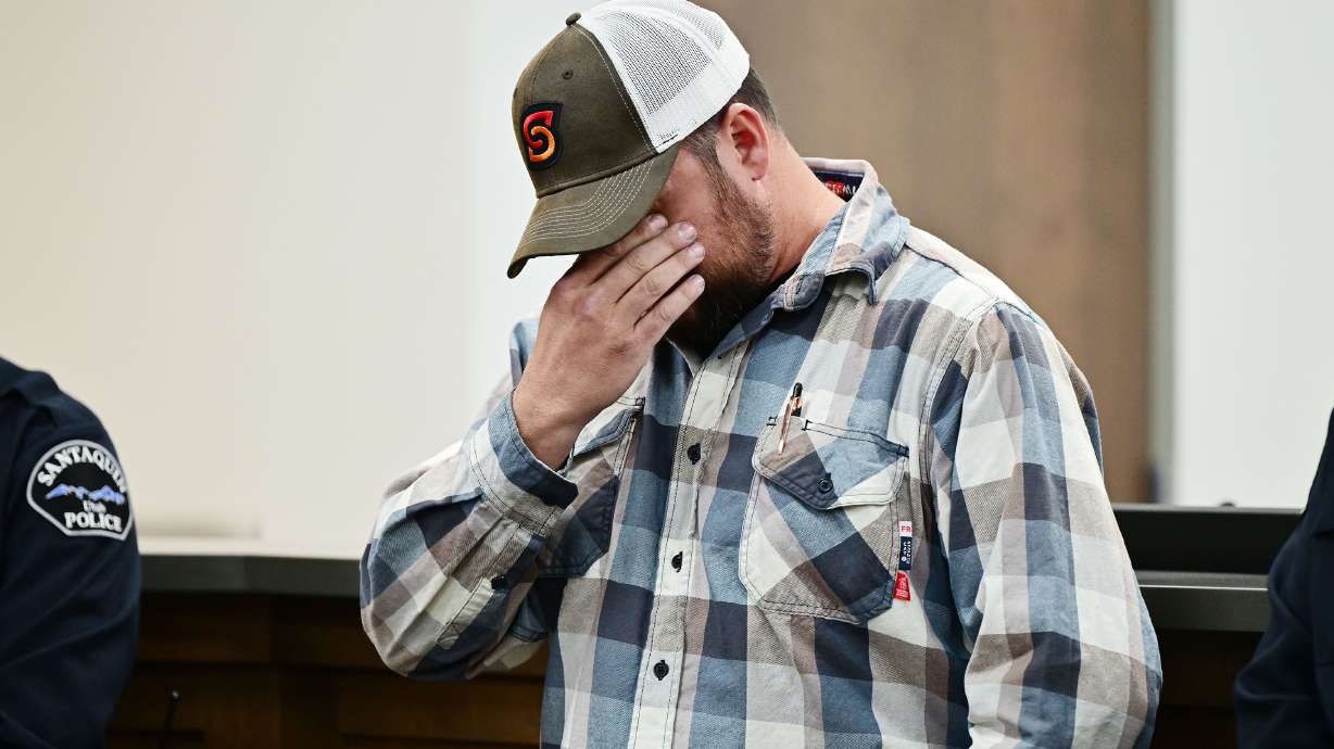 Michael Hooser, brother of fallen Santaquin Police Sgt. Bill Hooser, wipes his eyes as he attends a press conference with law enforcement after bringing his brother's body back to Santaquin on Monday.