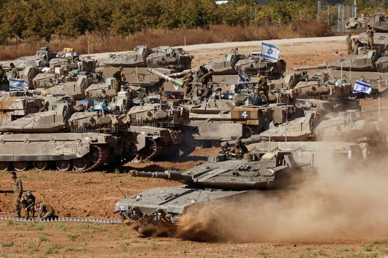 An Israeli tank maneuvers, amid the ongoing conflict between Israel and the Palestinian Islamist group Hamas, near the Israel-Gaza Border, in southern Israel, Tuesday.