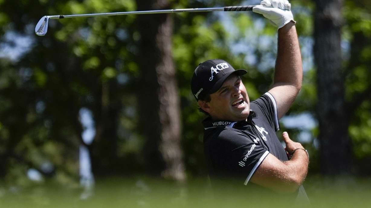 Patrick Reed reacts to his tee shot on the fourth hole during final round at the Masters golf tournament at Augusta National Golf Club Sunday, April 14, 2024, in Augusta, Ga.
