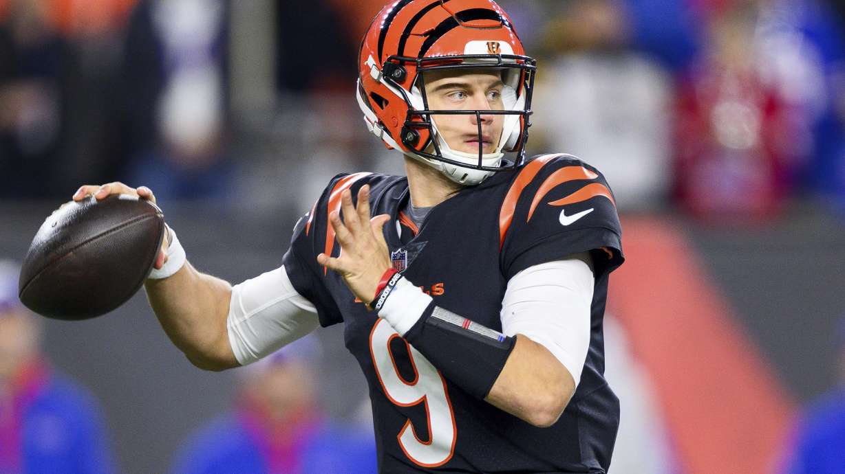 FILE - Cincinnati Bengals quarterback Joe Burrow (9) throws downfield during an NFL football game against the Buffalo Bills, Sunday, Nov. 5, 2023, in Cincinnati. The success stories are the reason why teams keep coming back hoping to get their franchise-lifting quarterback success story like Patrick Mahomes, Josh Allen, Lamar Jackson or Joe Burrow.