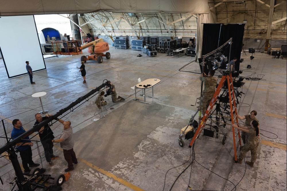 U.S. Air Force and NASA personnel prepare workspace for the Origins, Spectral Interpretation, Resource Identification, Security-Regolith Explorer mission at Michael Army Airfield, Utah, Sept. 18, 2023.