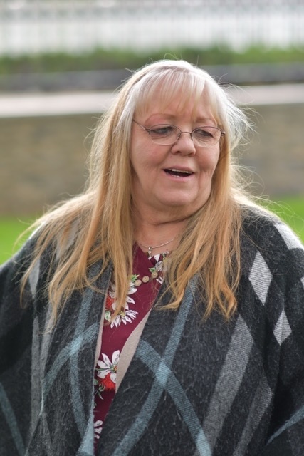 Carla Maas visits her former husband Buddy Booth's gravesite Elysian Gardens in Millcreek in April.