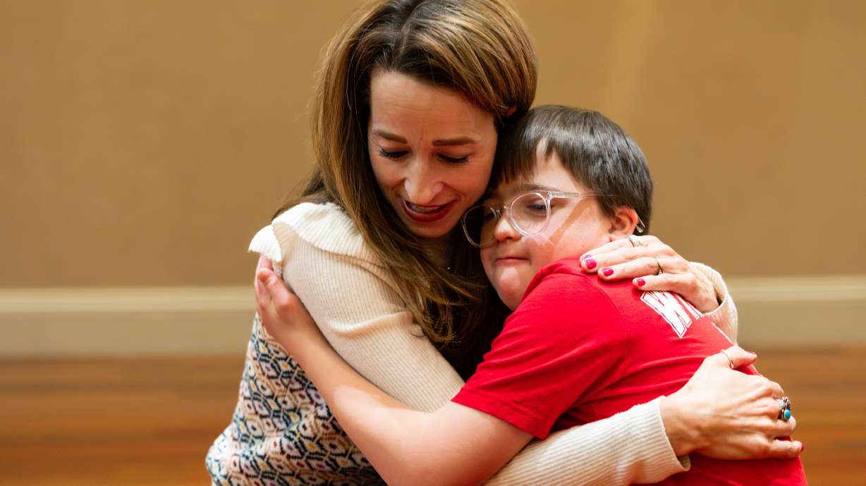 Utah first lady Abby Cox hugs Johnny Gessel, a student at Dancers Without Limits, a nonprofit program teaching dance to students with disabilities, at Creative Arts Academy in Bountiful on Tuesday.