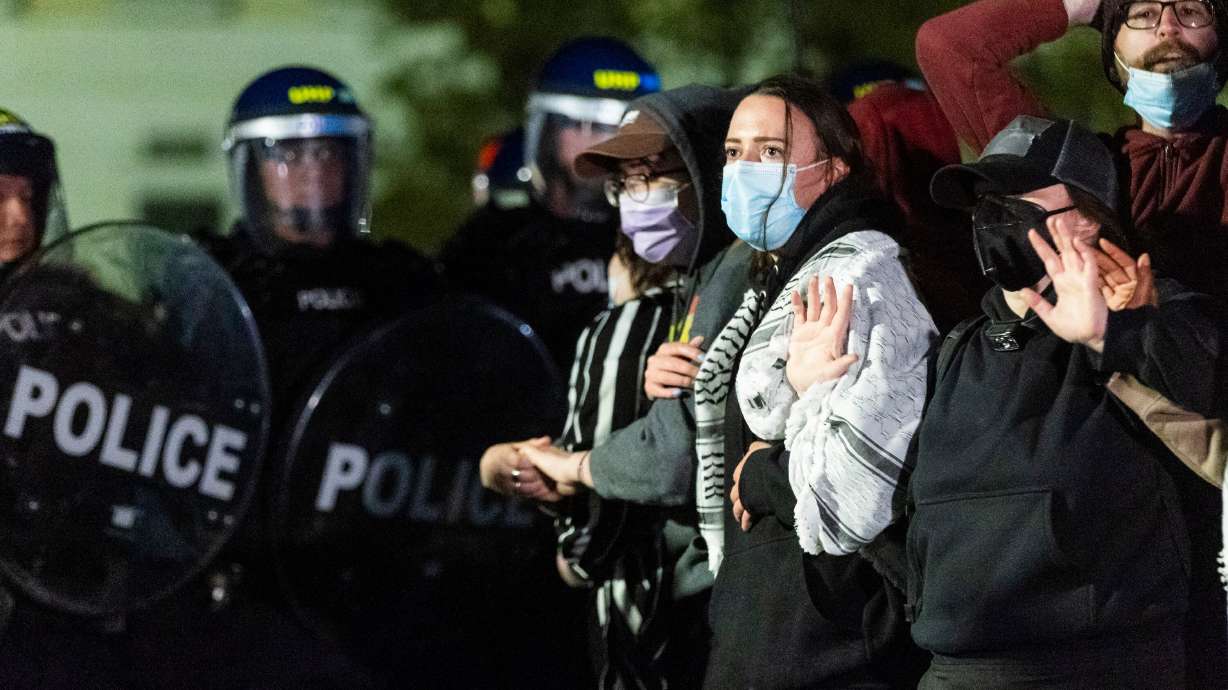 Demonstrators lock arms in front of a police line at the Presidents Circle in support of Palestine at the University of Utah in Salt Lake City on April 29. In the wake of the protests last week, the university community is seeking ways to move forward.