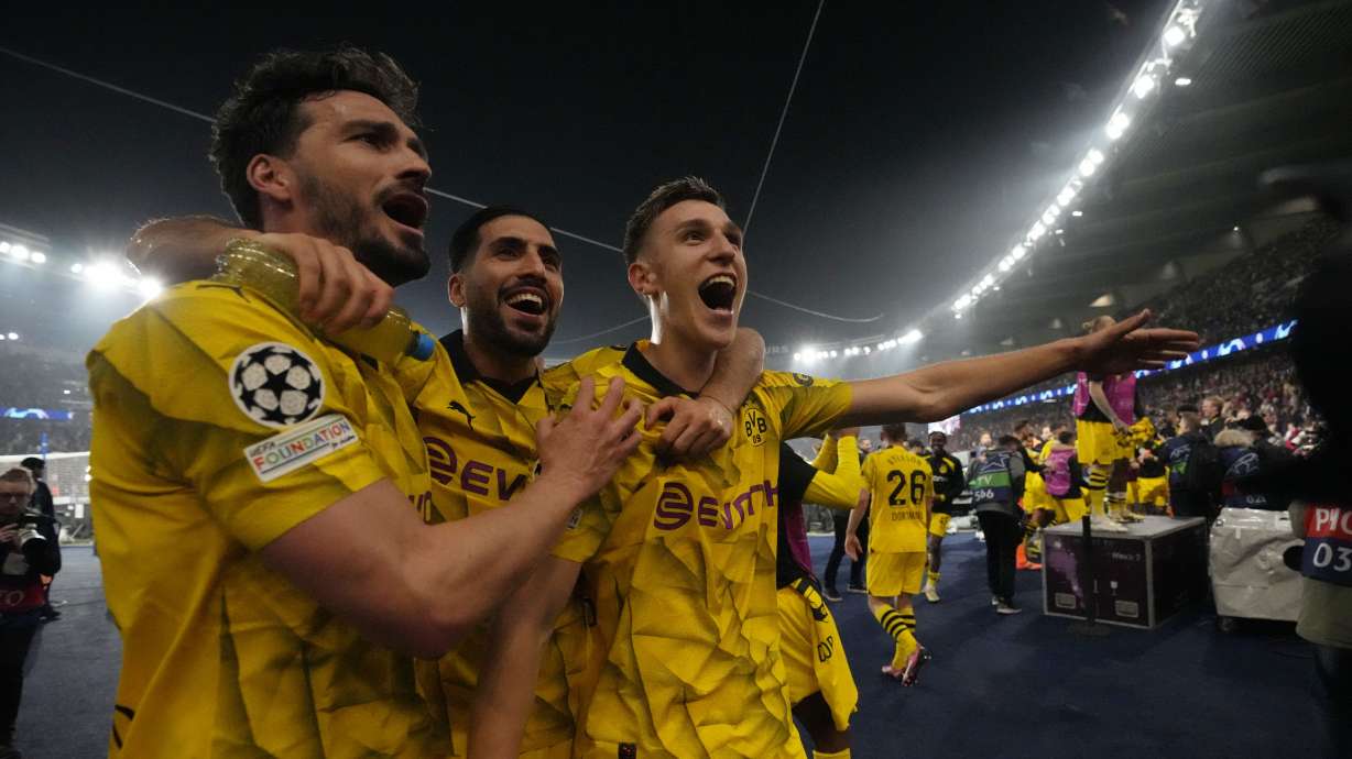Borussia Dortmund players celebrate at the end of the Champions League semifinal second leg soccer match between Paris Saint-Germain and Borussia Dortmund at the Parc des Princes stadium in Paris, France, Tuesday, May 7, 2024.