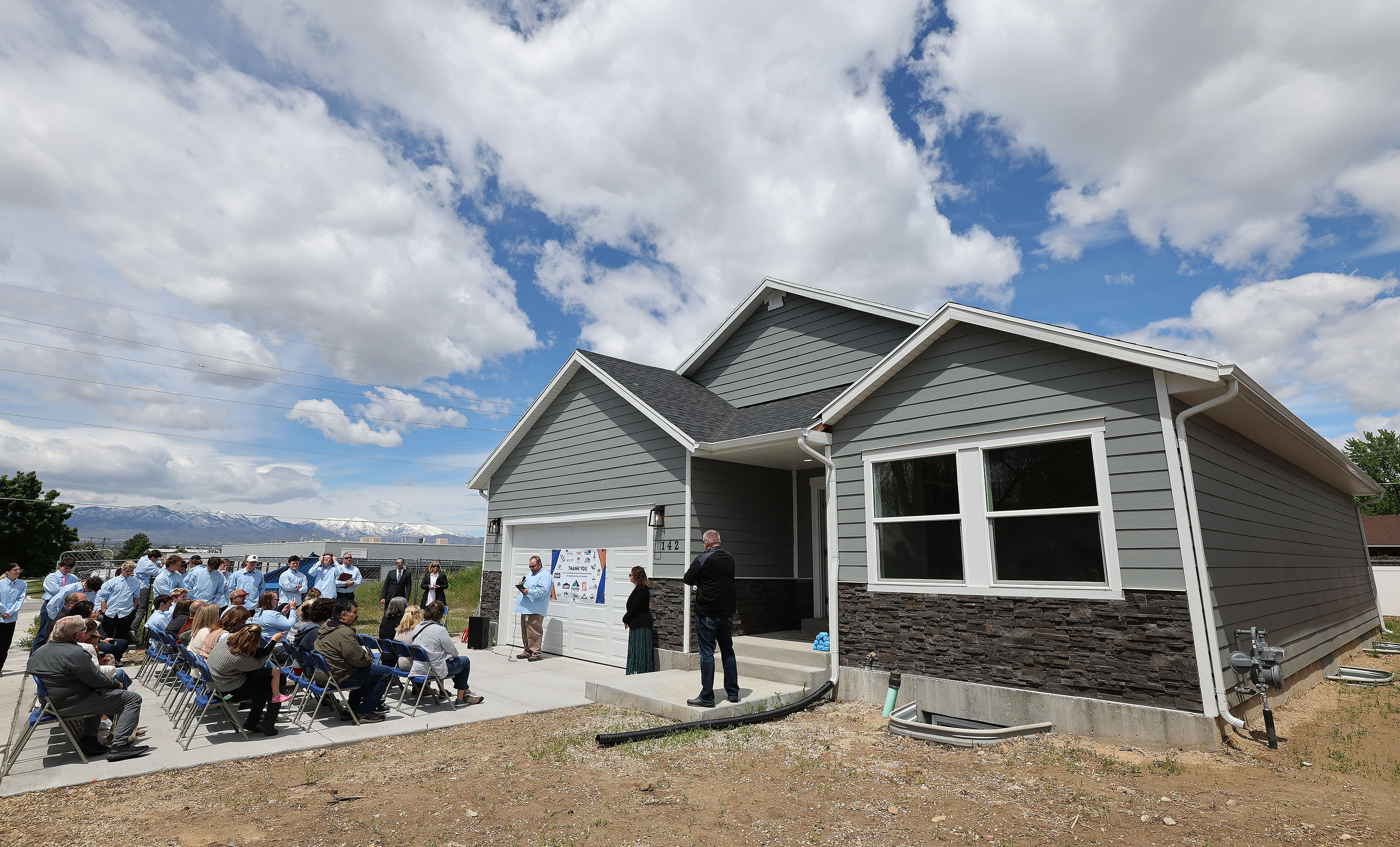 Canyons Technical Education Center students look over the home they built in Sandy on Wednesday.