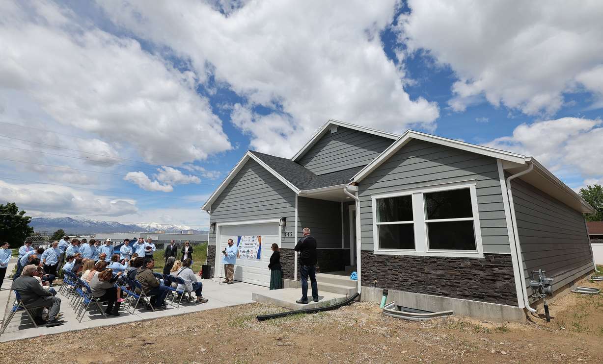 Canyons Technical Education Center students look over the home they built in Sandy on Wednesday.