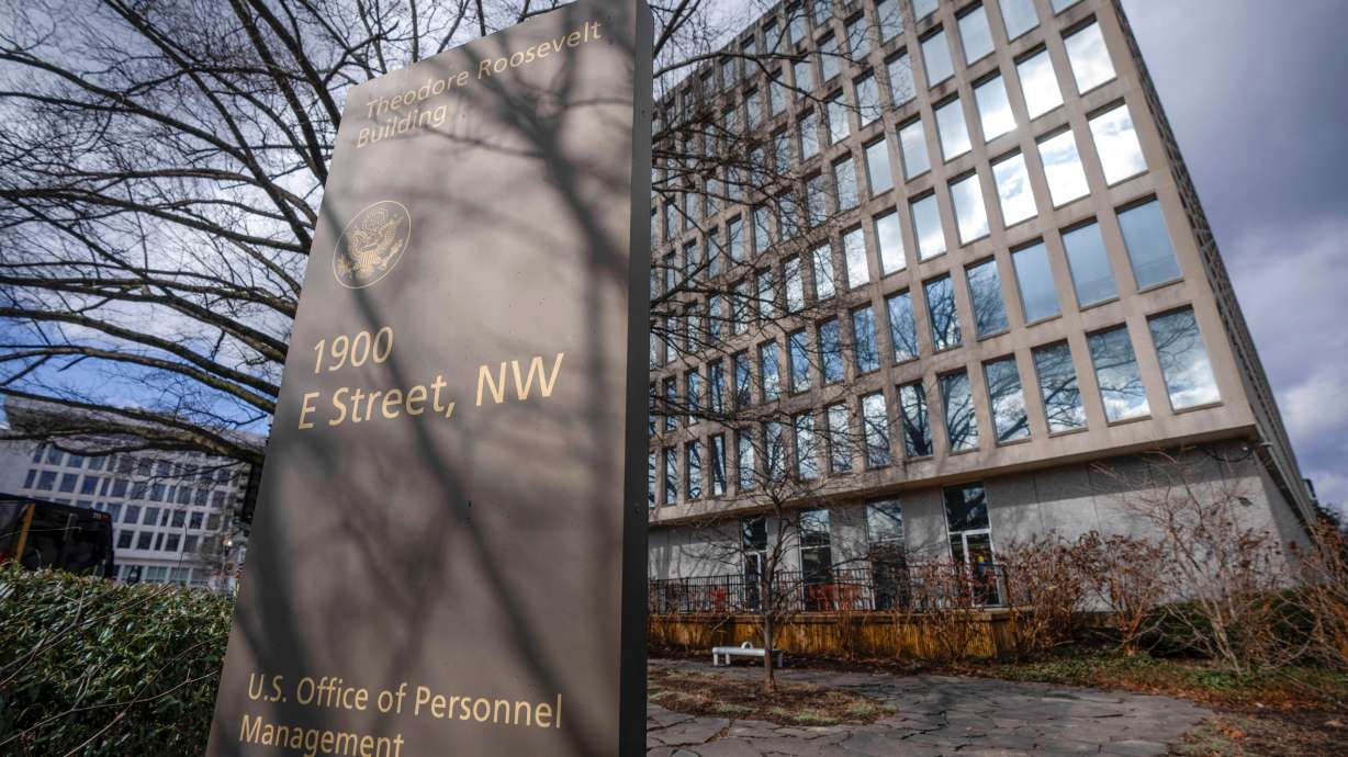 The Theodore Roosevelt Building, location of the U.S. Office of Personnel Management, is seen on Feb. 13, in Washington. Federal employees need to return to their offices, say Utah Sen. Mitt Romney.