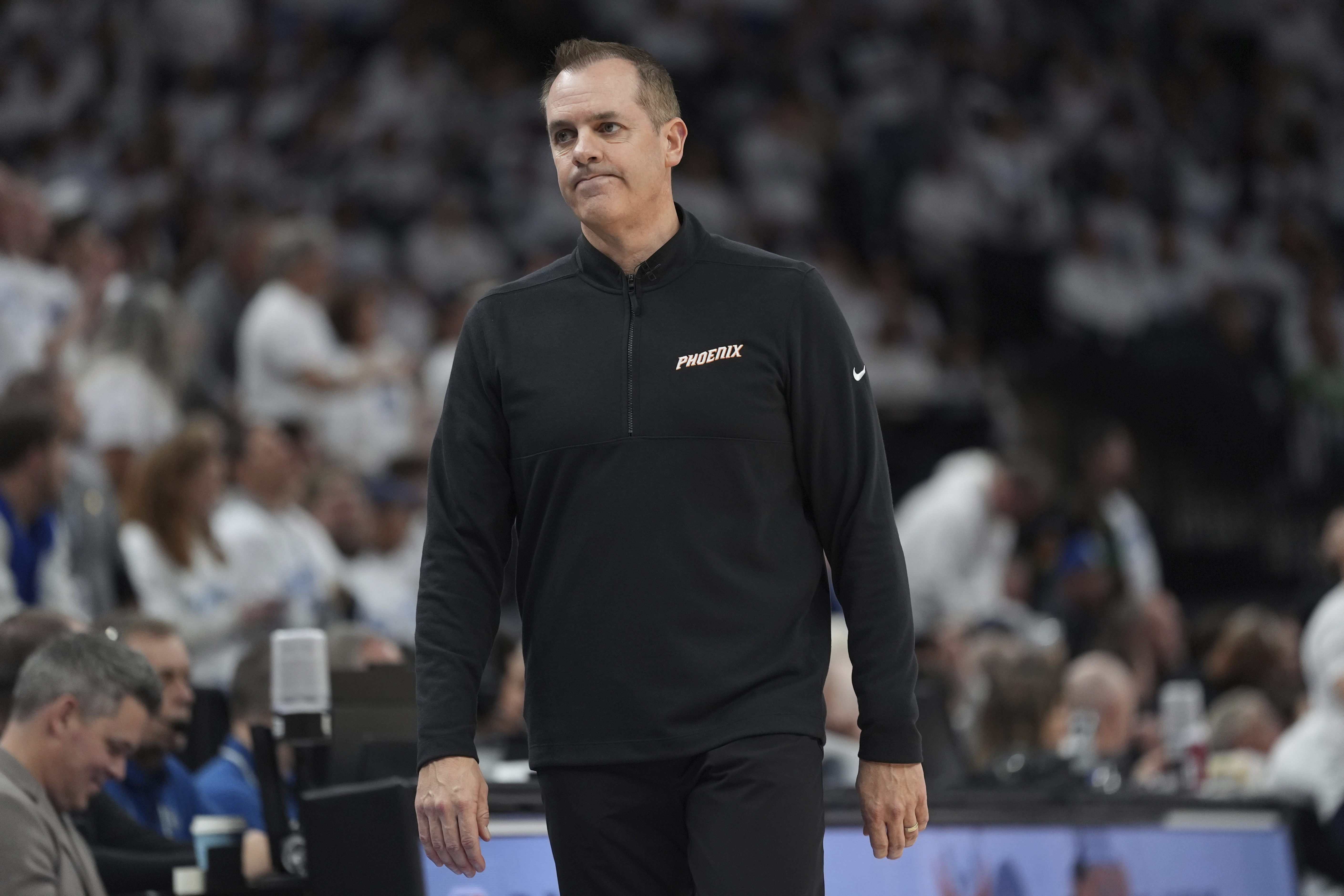Phoenix Suns head coach Frank Vogel walks toward the bench during the first half of Game 1 of an NBA basketball first-round playoff series against the Minnesota Timberwolves, Saturday, April 20, 2024, in Minneapolis.