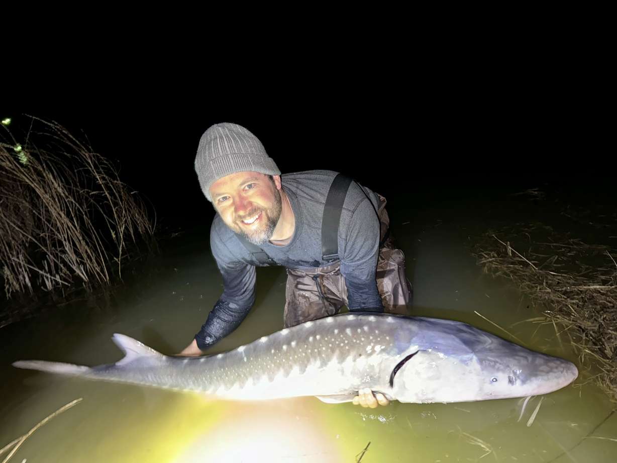Grant Olsen poses with his first-ever sturgeon from the Snake River.