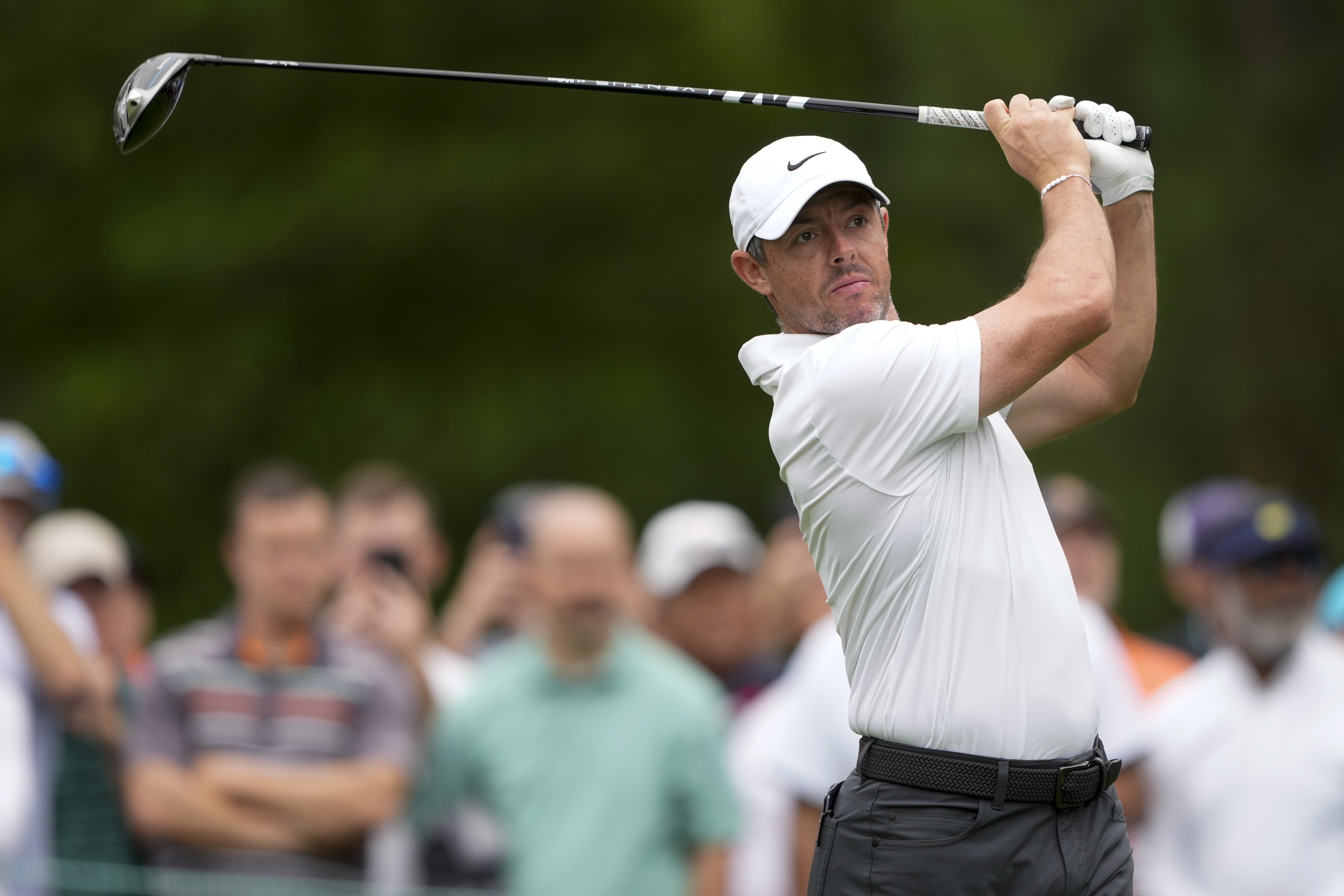 Rory McIlroy, of Northern Ireland, watches his tee shot on the third hole first round of the Wells Fargo Championship golf tournament at the Quail Hollow Club Thursday, May 9, 2024, in Charlotte, N.C.