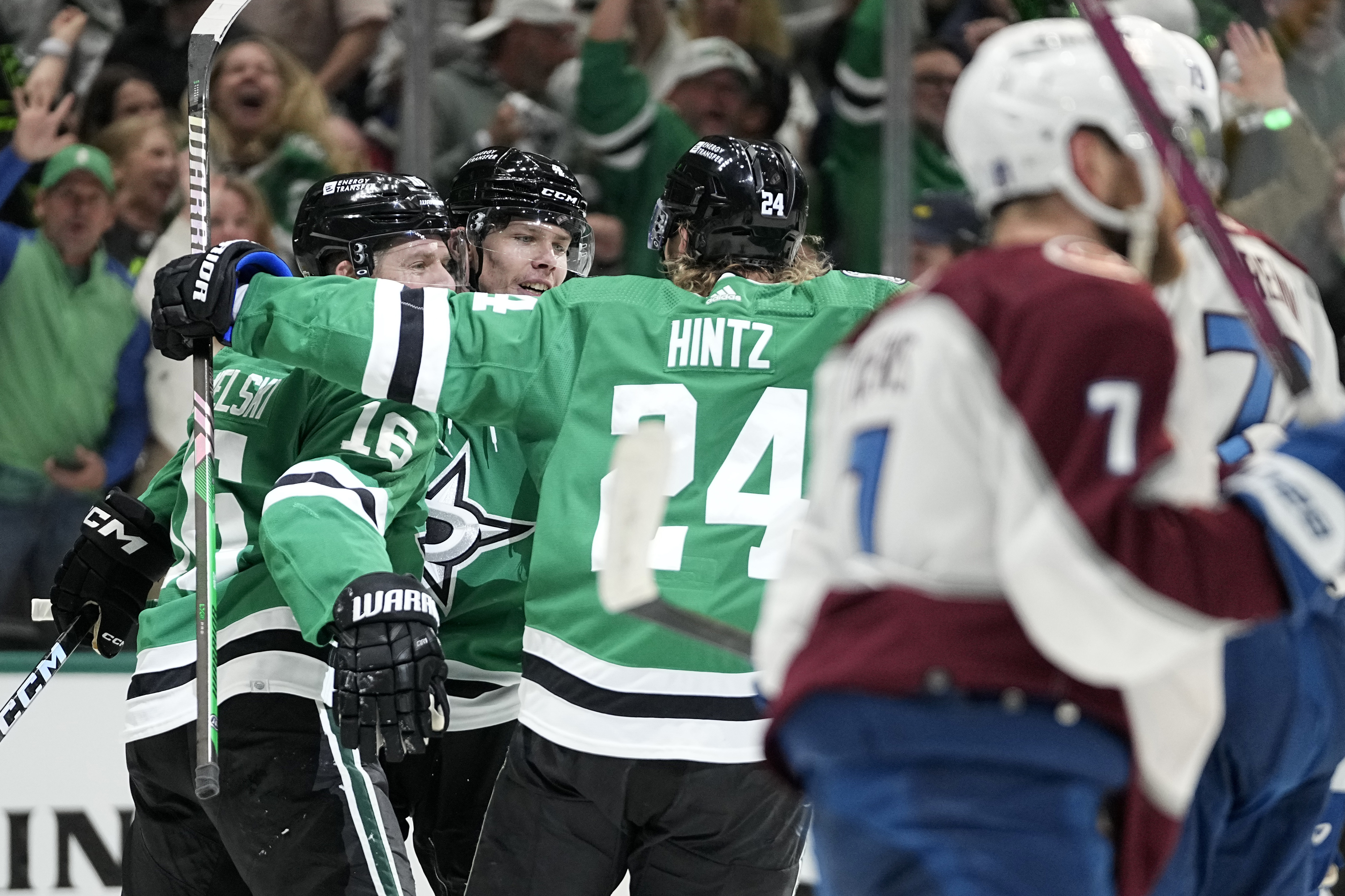 Dallas Stars' Joe Pavelski (16), Miro Heiskanen, rear, and Roope Hintz (24) celebrate a goal by Heiskanen, as Colorado Avlanches's Devon Toews (7) skates to the bench during the first period in Game 2 of an NHL hockey Stanley Cup second-round playoff series in Dallas, Thursday, May 9, 2024.