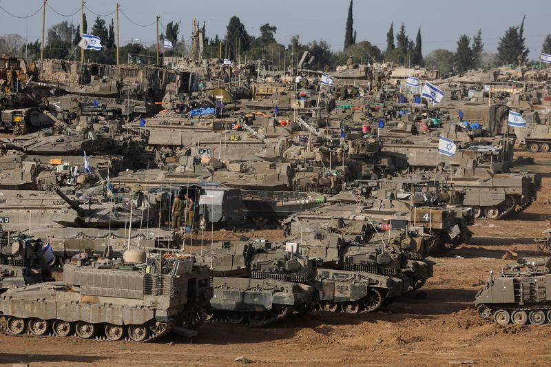 Israeli military vehicles are seen near the Israel-Gaza Border, amid the ongoing conflict between Israel and the Palestinian Islamist group Hamas, in southern Israel, Thursday.