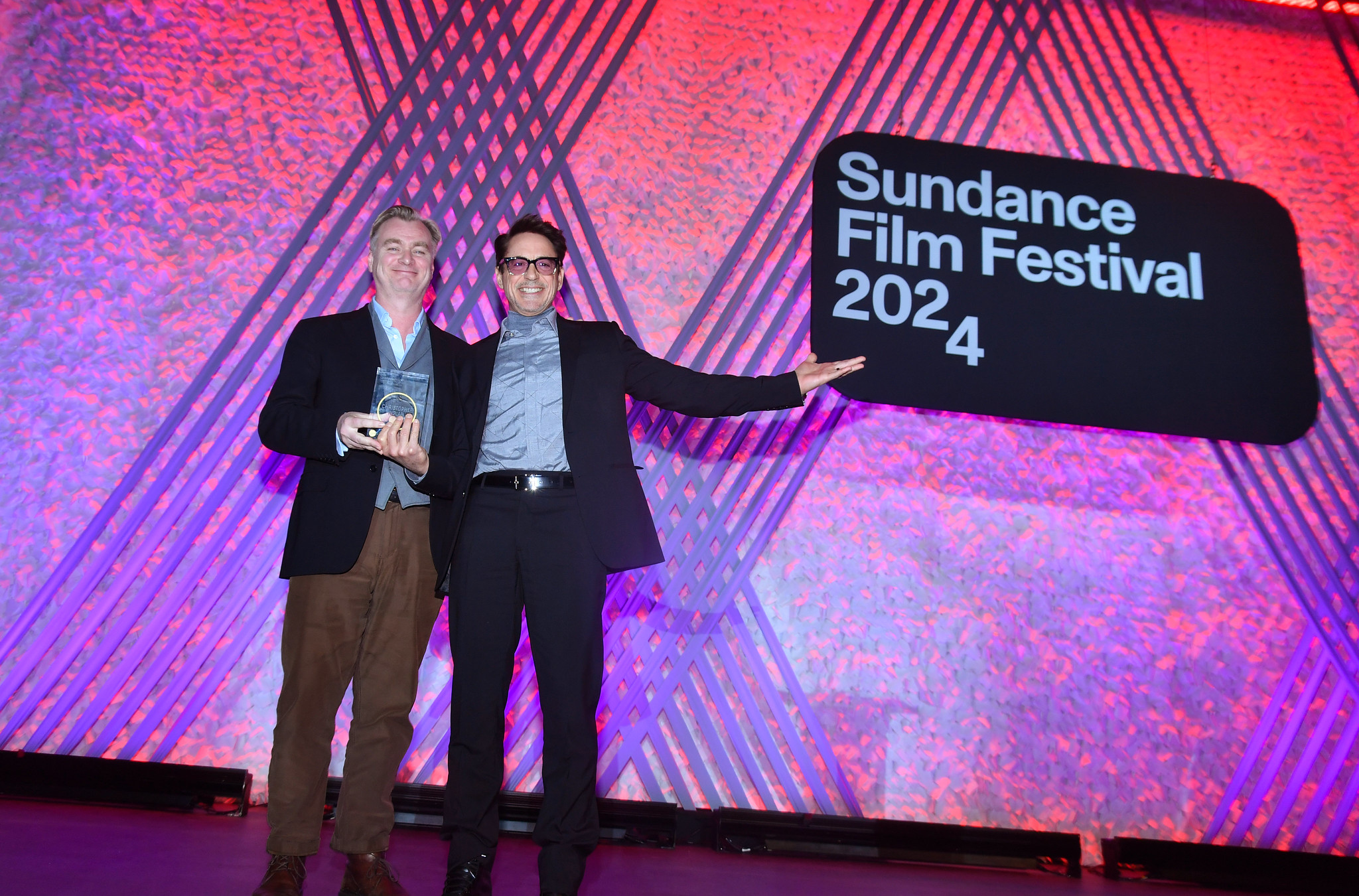 Christopher Nolan and Robert Downey Jr. pose on the stage of Sundance Film Festival's Opening Night Gala on Jan.y 18.