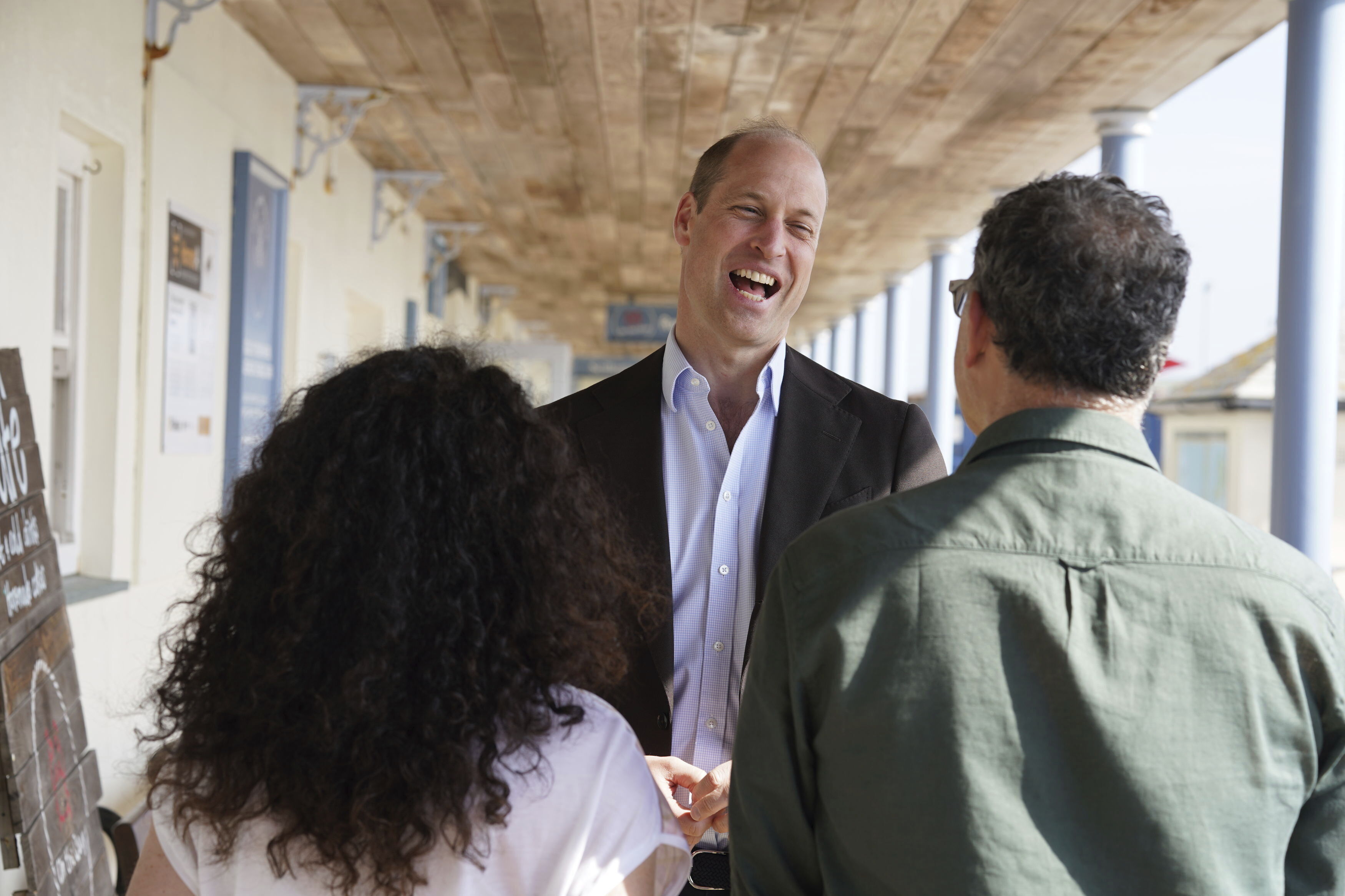 Britain's Prince William is seen on a visit to St. Mary's Harbor to meet representatives from local businesses operating in the area, Friday. William has offered a positive assessment of his wife's health.