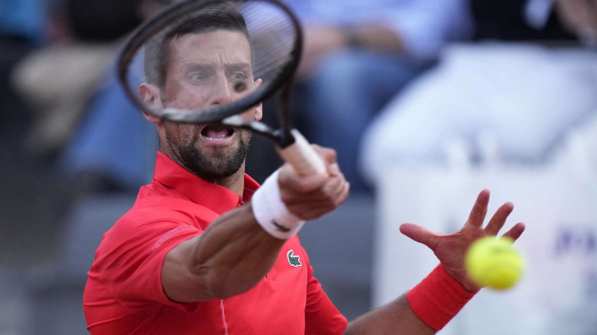 Serbia's Novak Djokovic returns the ball to France's Corentin Moutet at the Italian Open tennis tournament in Rome, Friday, May 10, 2024.