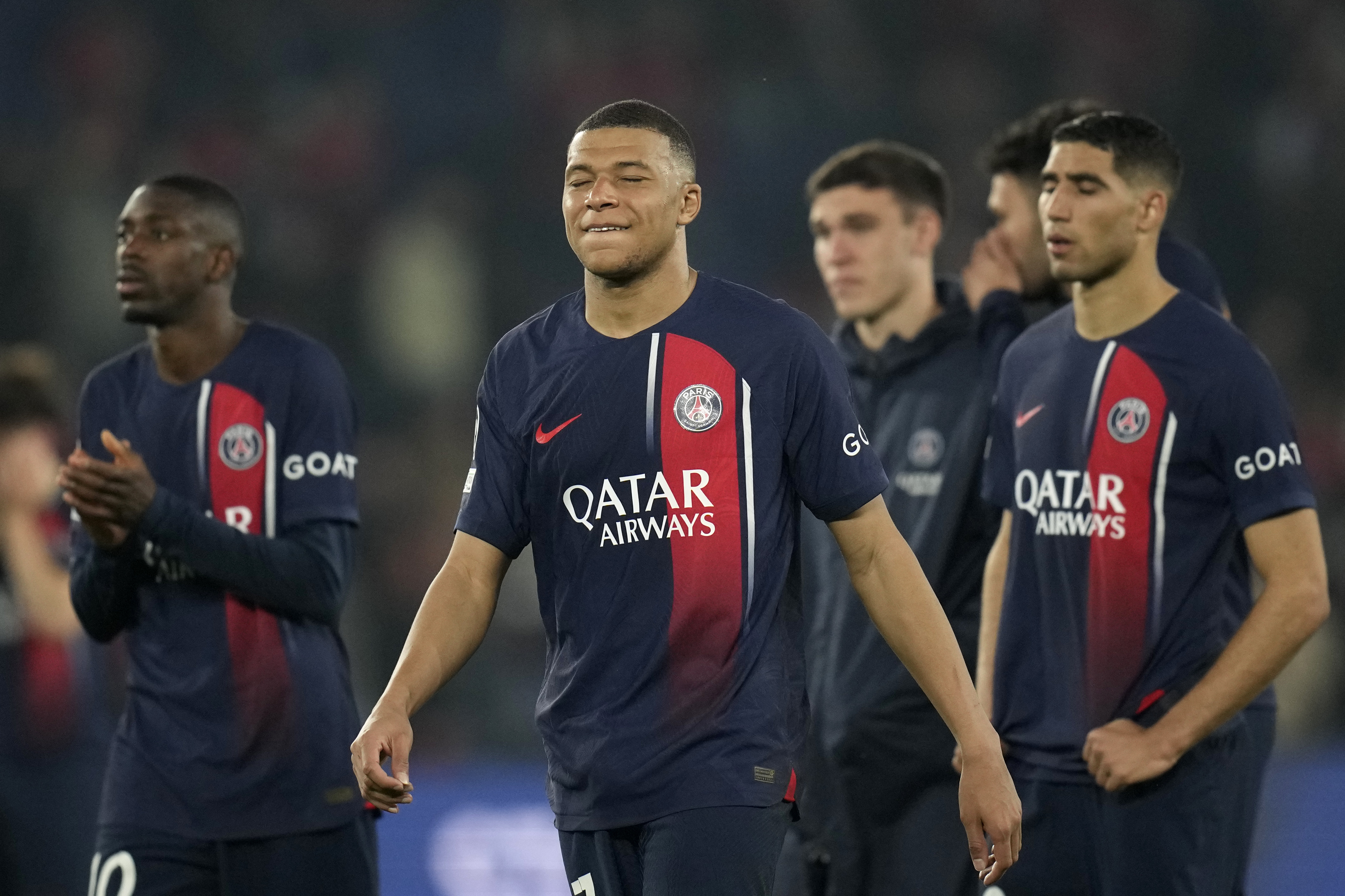 PSG's Kylian Mbappe and his teammates react after the Champions League semifinal second leg soccer match between Paris Saint-Germain and Borussia Dortmund at the Parc des Princes stadium in Paris, France, Tuesday, May 7, 2024.
