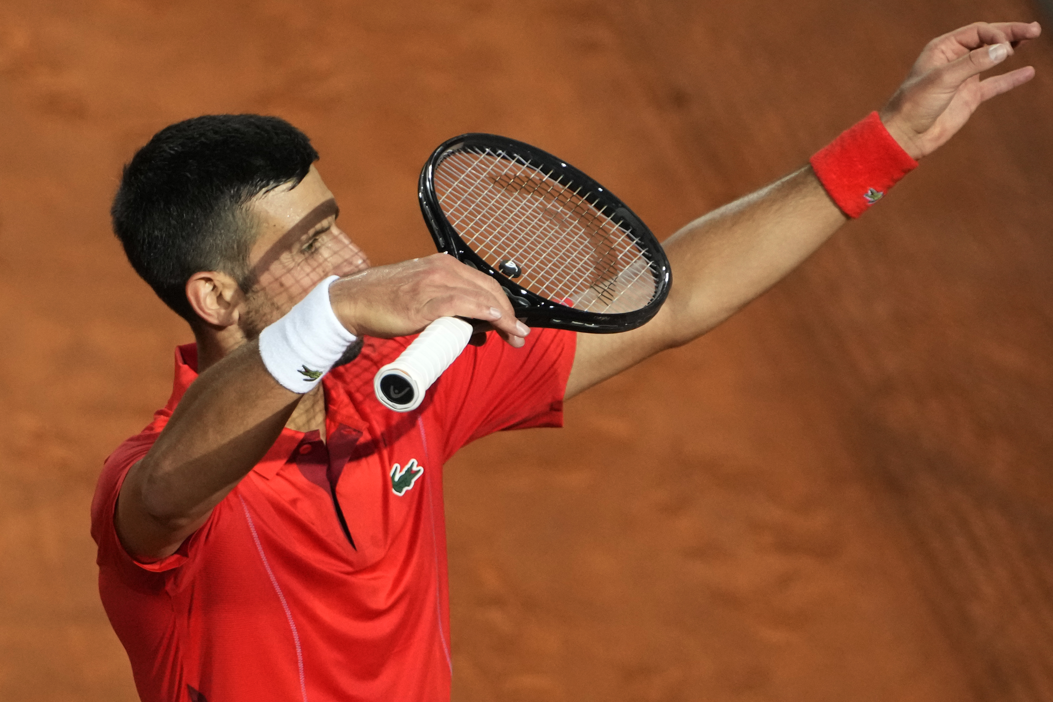 Serbia's Novak Djokovic celebrates after winning a match against France's Corentin Moutet at the Italian Open tennis tournament in Rome, Friday, May 10, 2024. 