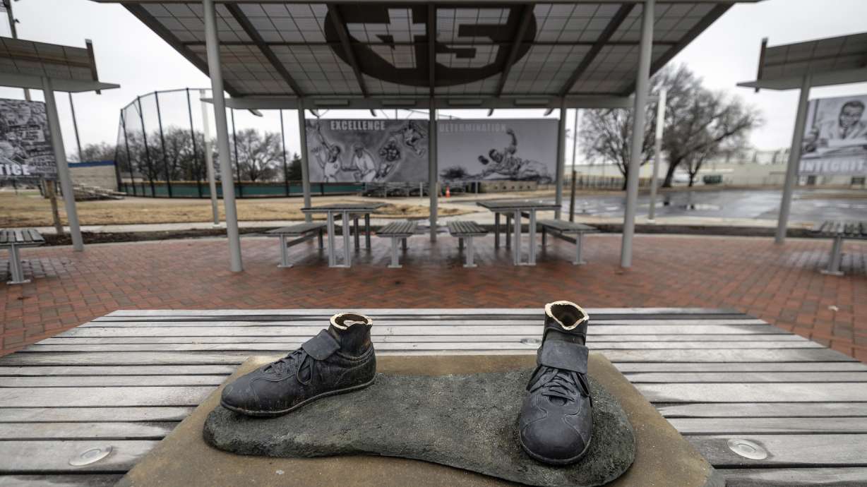 FILE - Bronze feet are left behind after the statue of legendary baseball pioneer Jackie Robinson was stolen from a park in Wichita, Kan., early Jan. 25, 2024. A 45-year-old man has pleaded guilty in the theft of the statue that was cut off at the ankles and found days later smoldering in a trash can in a city park in Kansas.