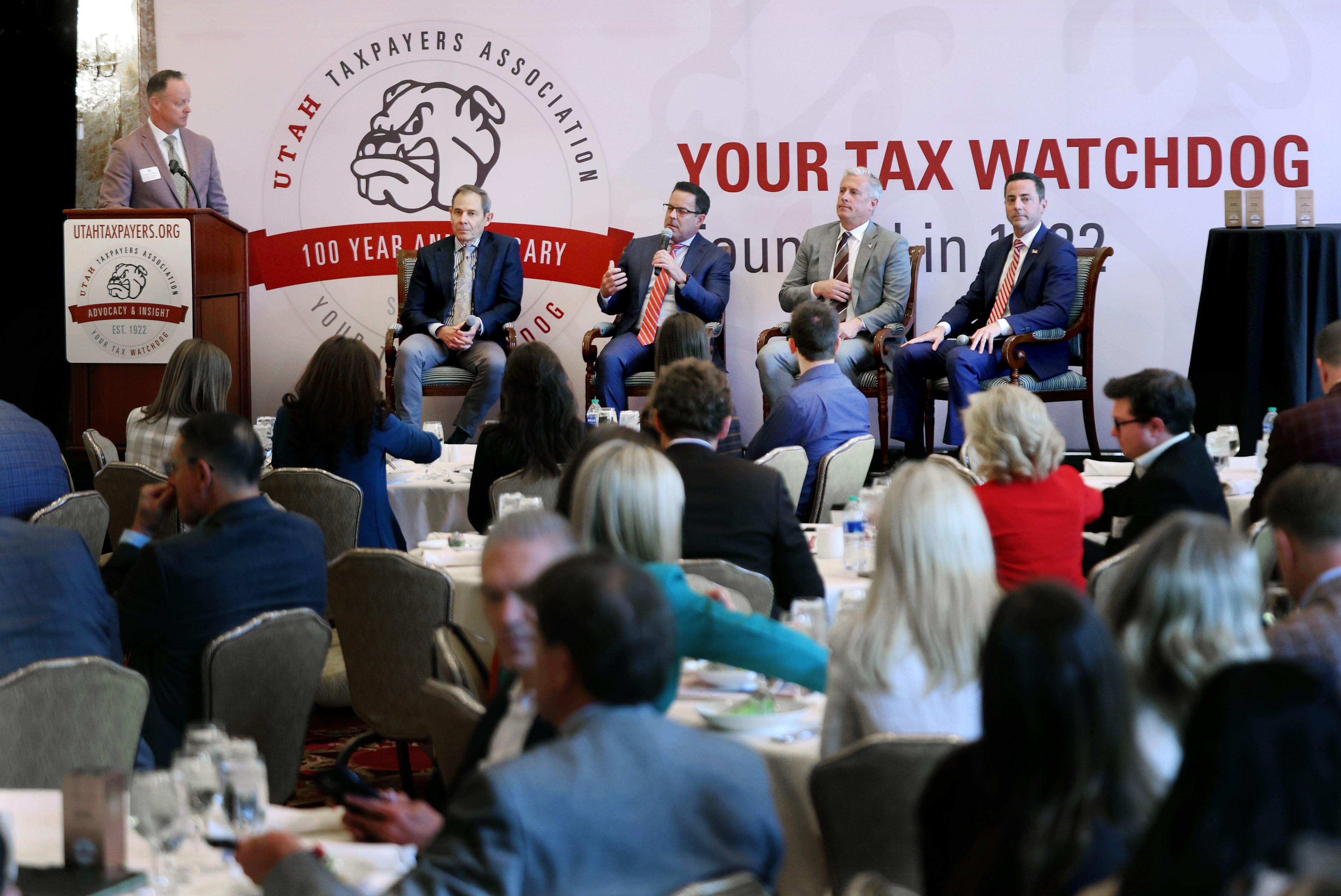 Rusty Cannon, president of the Utah Taxpayers Association, moderates a discussion with United States Senate candidates John Curtis, Brad Wilson, Jason Walton and Trent Staggs at the Utah Taxpayers Association Annual Taxes Now Conference at The Grand America Hotel in Salt Lake City on Friday.