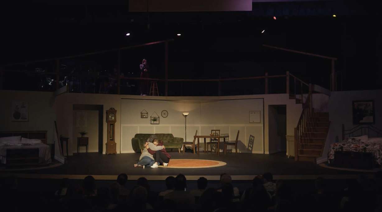 Actresses Liz Golden and Leah Carr hug onstage during a performance of "Relative Space" in June 2023.