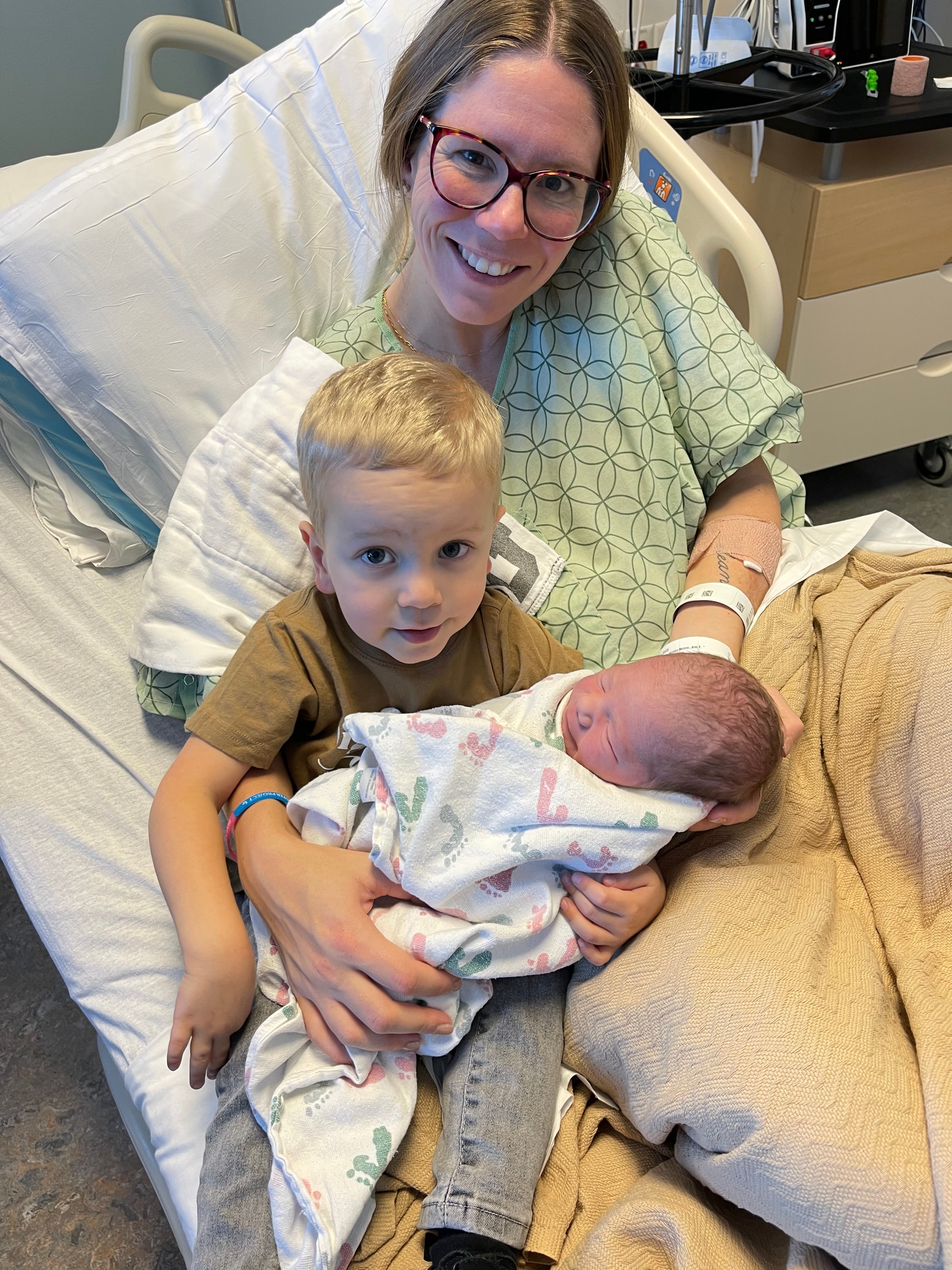 Emily Scott sits with her sons Colson and Elliott in this undated photo. She lost a baby at 31 weeks of pregnancy before Elliott was born.