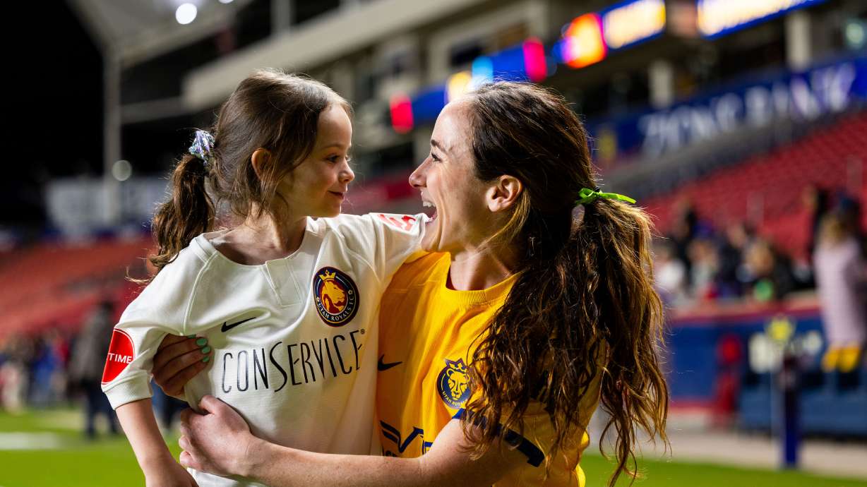 Michele Vasconcelos, Utah Royals midfielder, poses for a photo with her daughter Scarlett, 6, at America First Field in Sandy on Friday, May 3.