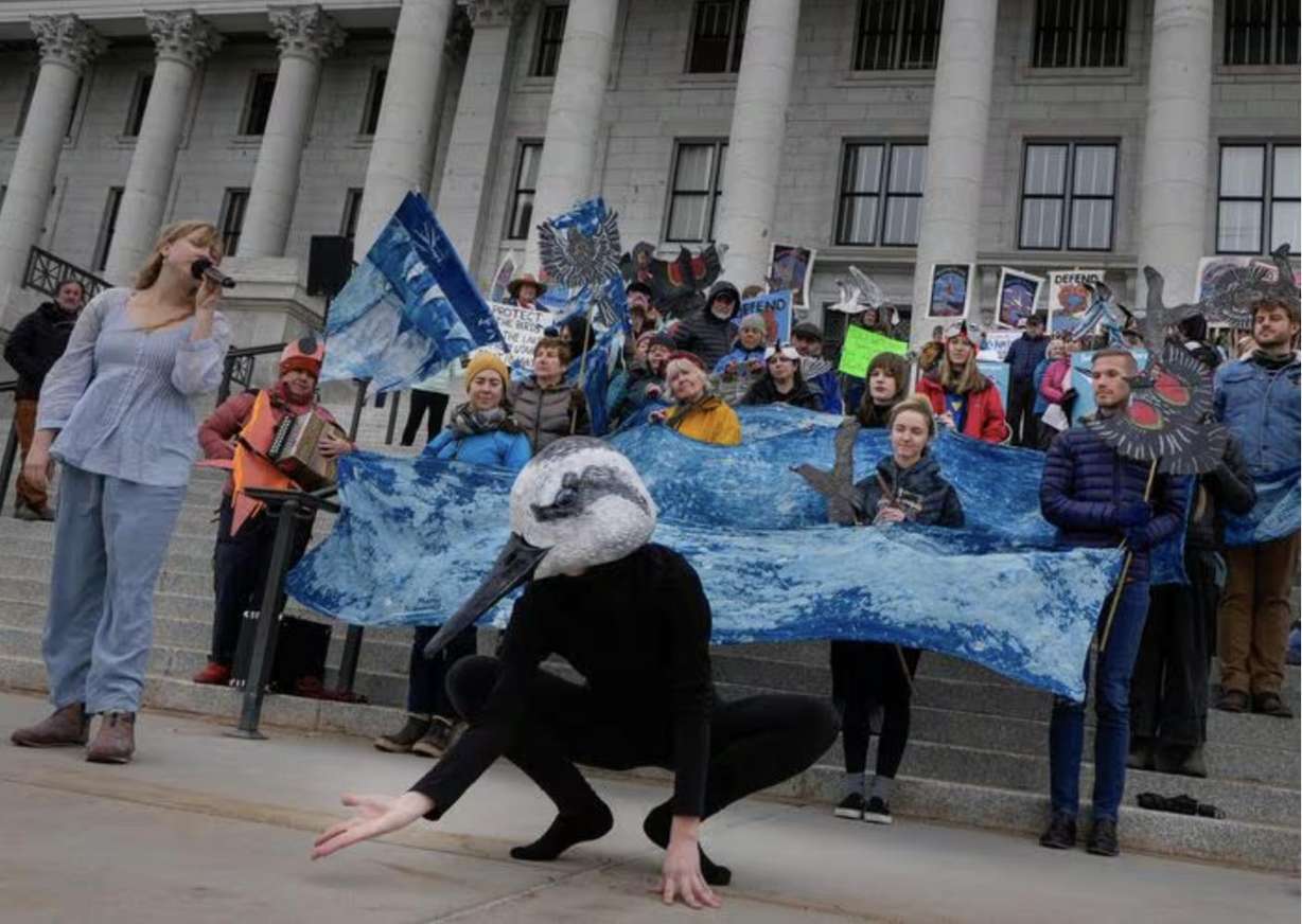 Eco-performance artists Sarah Ann Woodbury, left, and Bryn Watkins, representing a Wilson's phalarope, perform at the state Capitol on March 28, 2024, as they join other advocates for a healthy Great Salt Lake and an threatened species act listing petition for the inland shorebird.