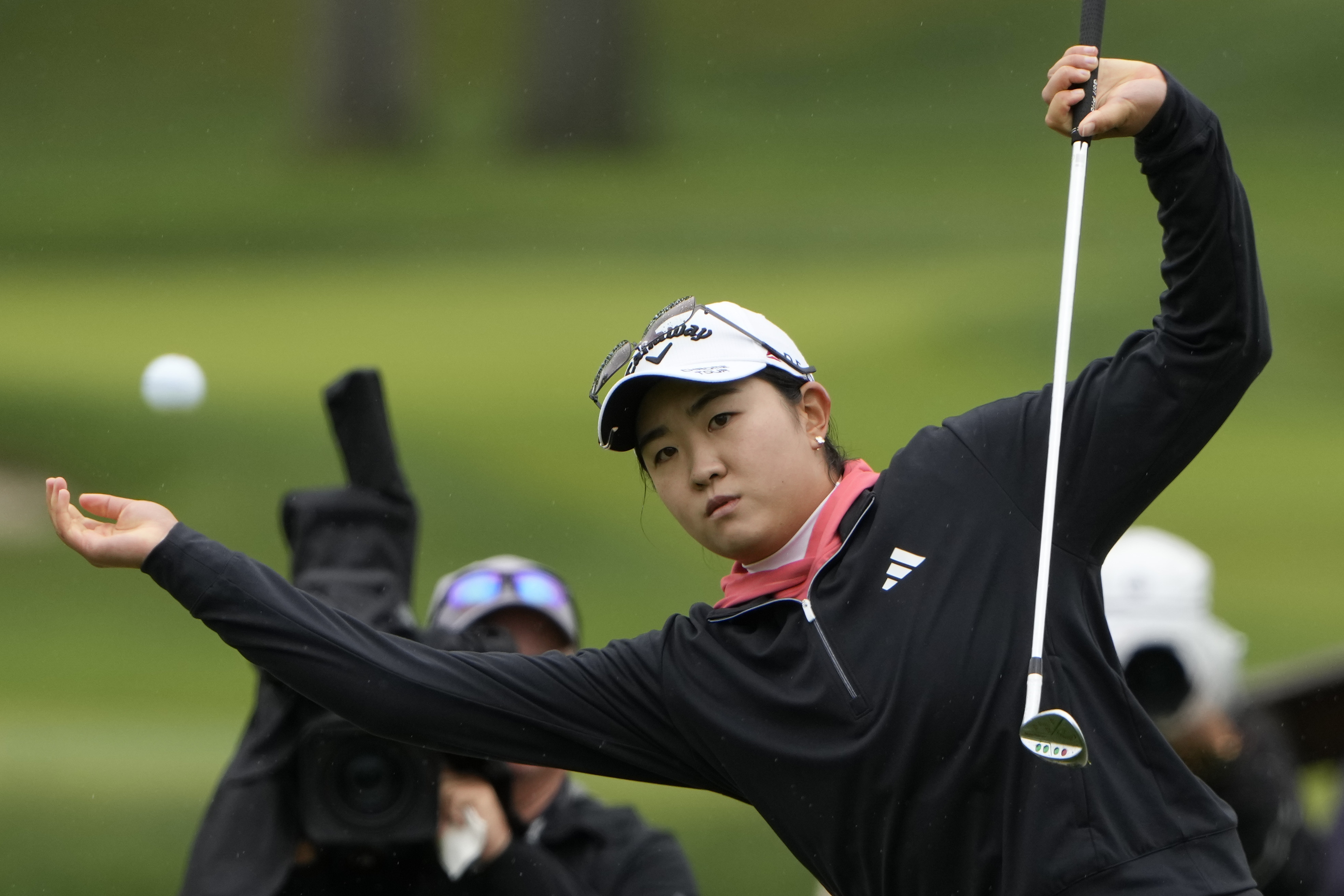 Rose Zhang loses her balance as she hits out of the rough on the first hole during the final round of the LPGA Cognizant Founders Cup golf tournament, Sunday, May 12, 2024, in Clifton, N.J. 