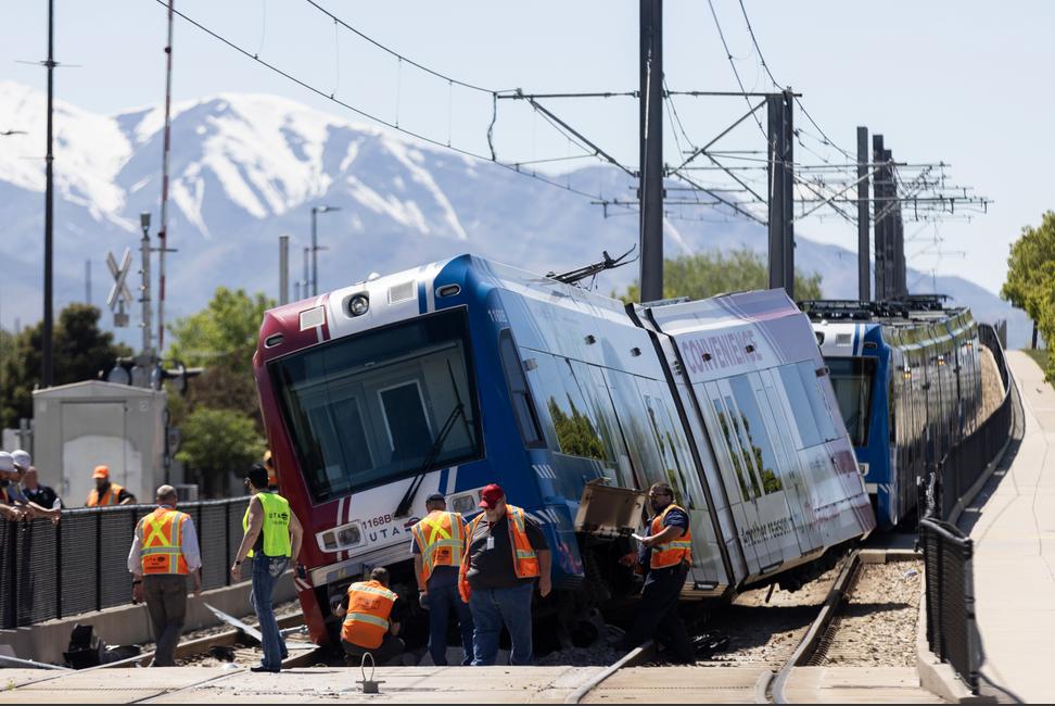 The last car of a TRAX train derailed at the Decker Lake station in West Valley City on Sunday.