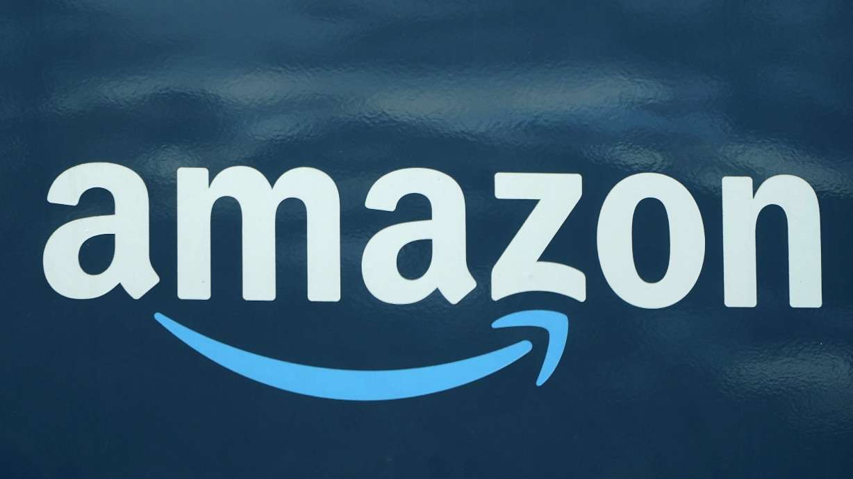 The logo on an Amazon delivery van in Boston, Oct. 1, 2020. Amazon's self-driving robotaxi unit is being investigated by the U.S. government's highway safety agency after two of its vehicles braked suddenly and were rear-ended by motorcyclists.
