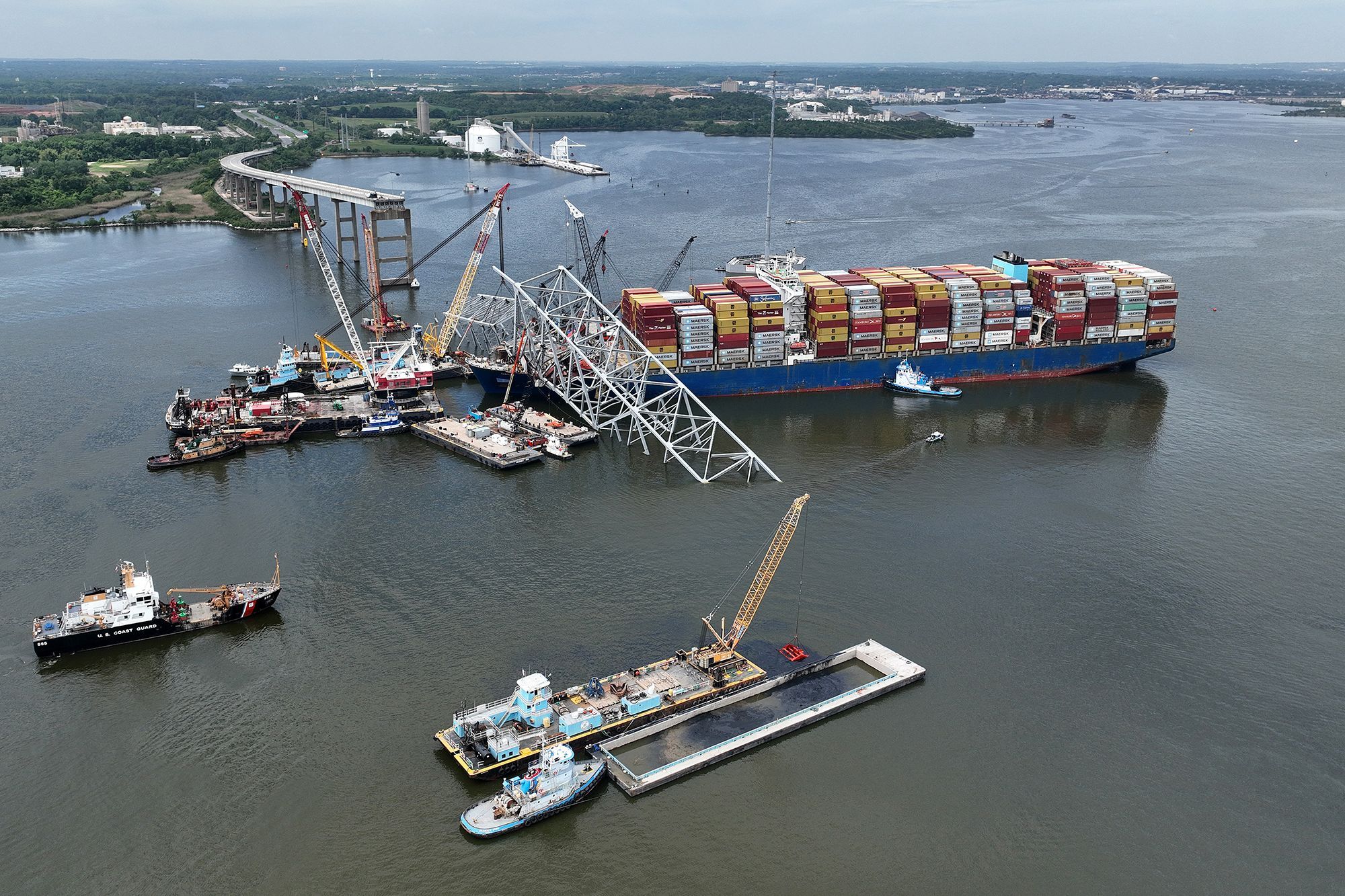 Salvage crews work to remove wreckage from the Dali on May 8, six weeks after the cargo ship collided with the Francis Scott Key Bridge in Baltimore, Maryland.