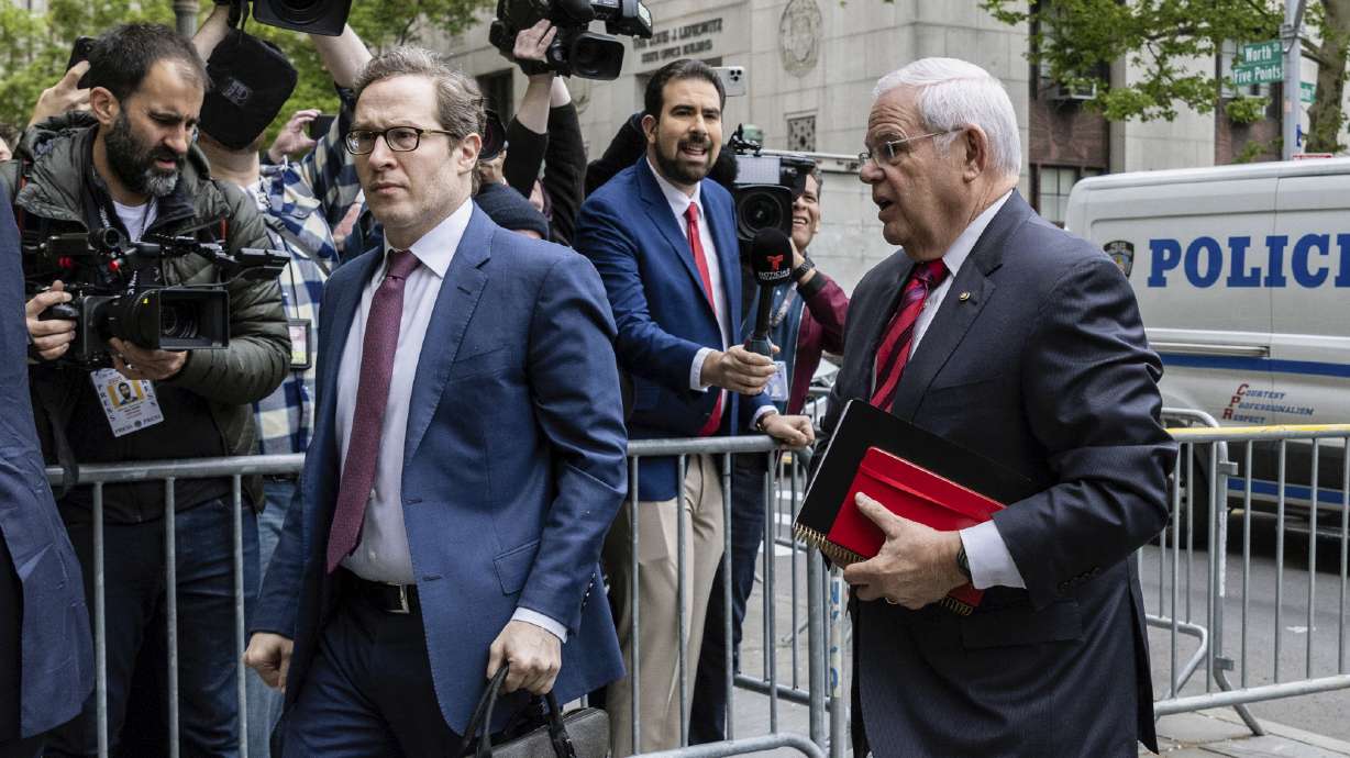 Sen. Bob Menendez, D-N.J., right, arrives for the first day of his trial at Manhattan federal court, Monday in New York.