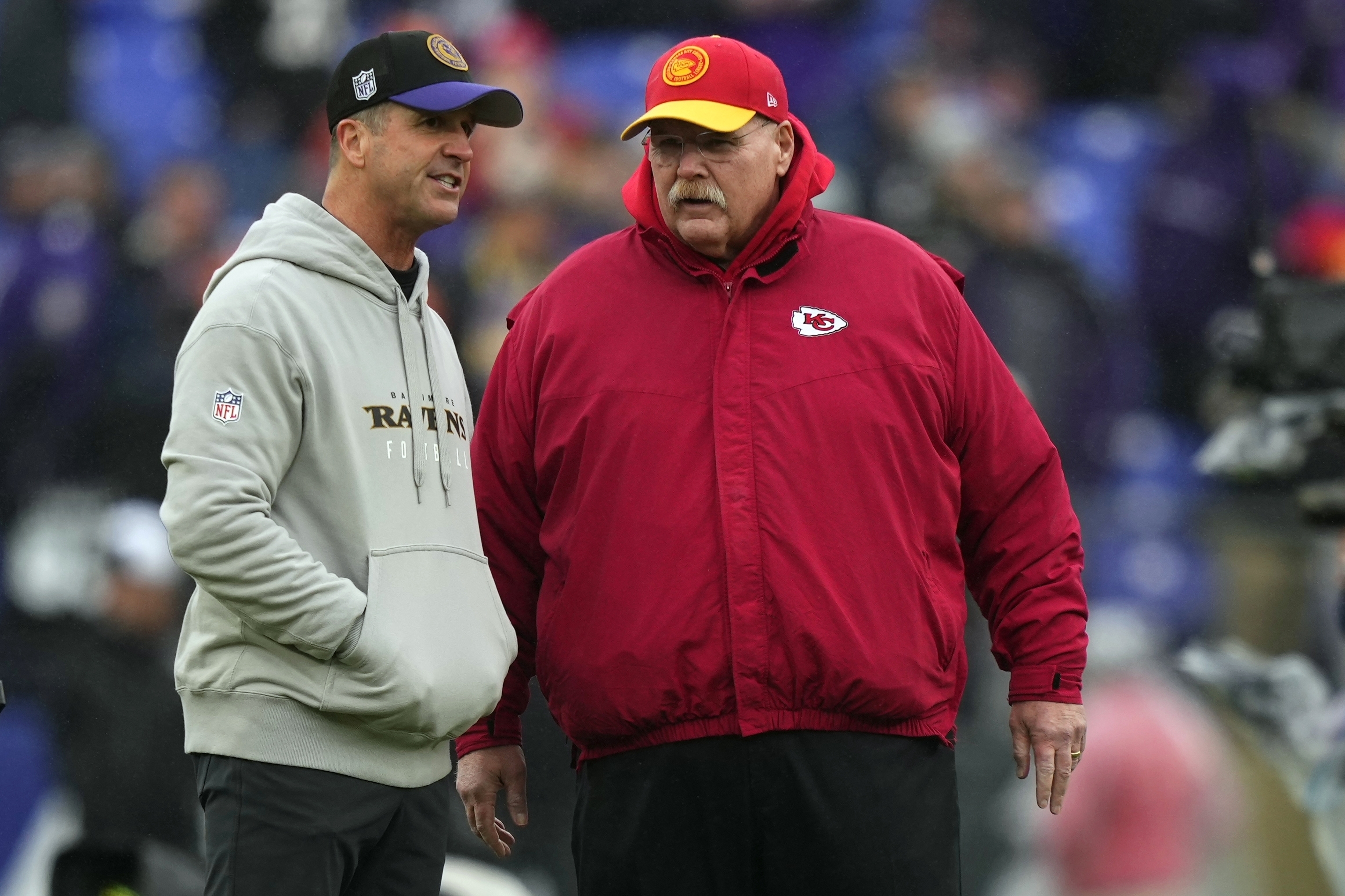 FILE - Kansas City Chiefs head coach Andy Reid and Baltimore Ravens head coach John Harbaugh talk before the AFC Championship NFL football game, Sunday, Jan. 28, 2024, in Baltimore. The NFL announced Monday, May 13, 2024, that the Super Bowl champion Kansas City Chiefs will open the season at home against the Baltimore Ravens on Thursday, Sept. 5. The game is a rematch of the AFC championship game in January, which the Chiefs won 17-10 in Baltimore.