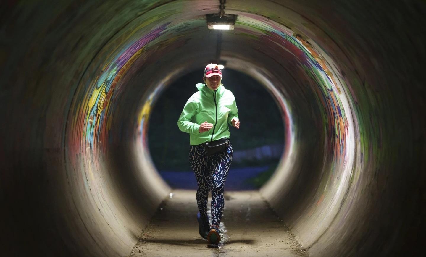Ultra runner Helen Ryvar runs through an underpass in Wrexham during running a half-marathon in Wrexham, Wales, March 20. 