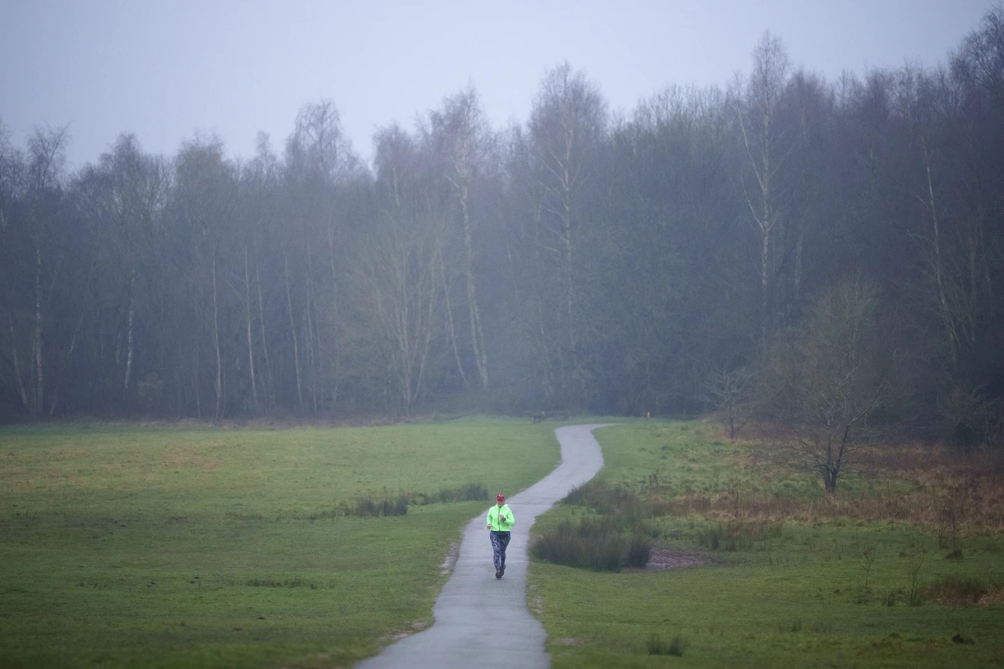 Ultra runner Helen Ryvar passes through Alyn Waters Country Park in Wrexham, Wales, on March 20.