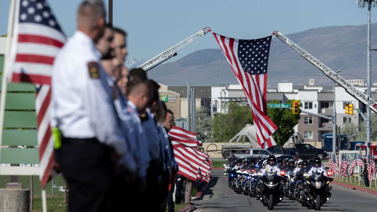 Officers escort the hearse for Santaquin Police Sgt. Bill Hooser’s funeral in Orem on May 12. Hooser was struck and killed by a semitruck while in the line of duty. The initial story about his tragic death was the most viewed story of the year on KSL.com.