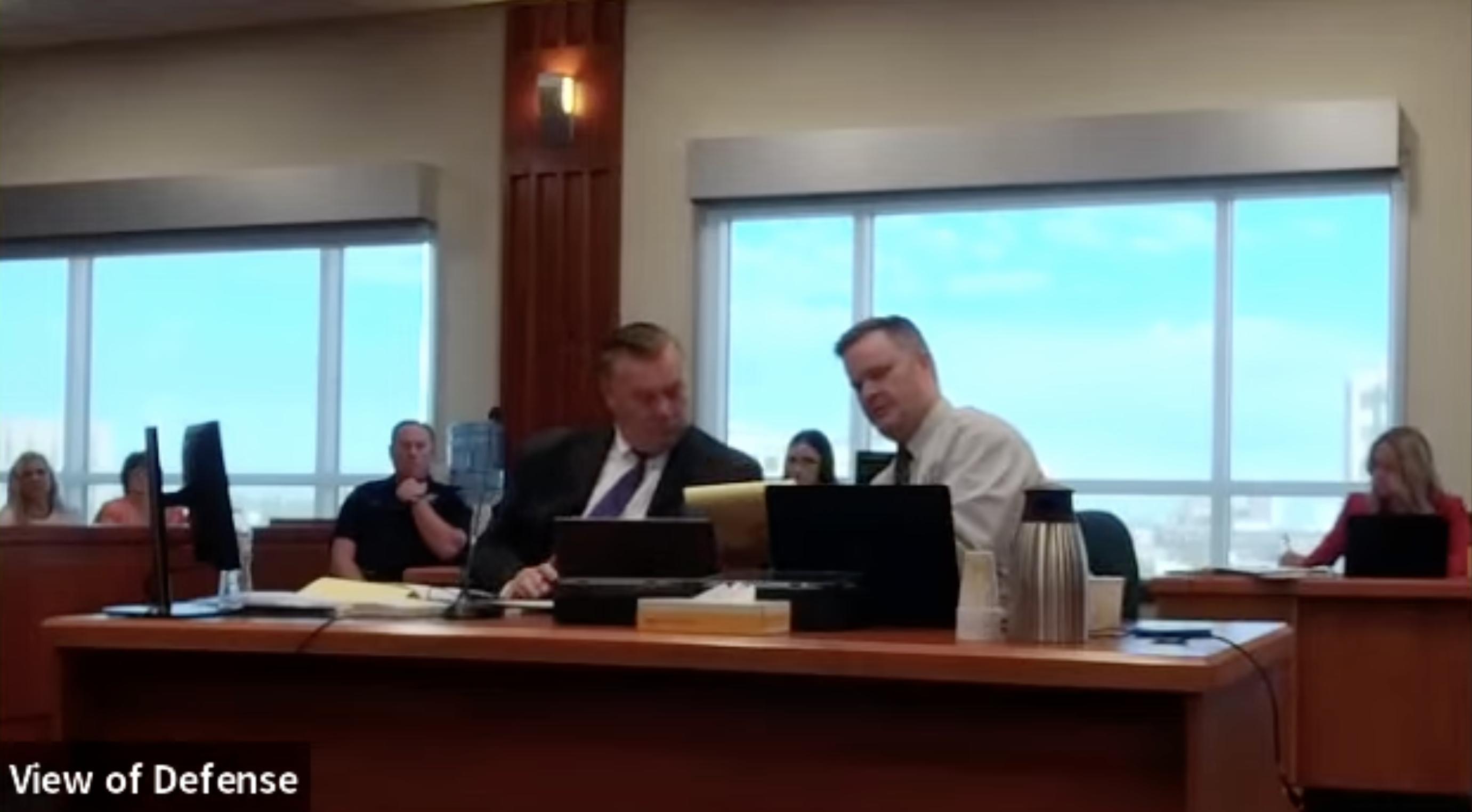 Chad Daybell, right, shows a note to his attorney, John Prior, during his jury trial on Monday.