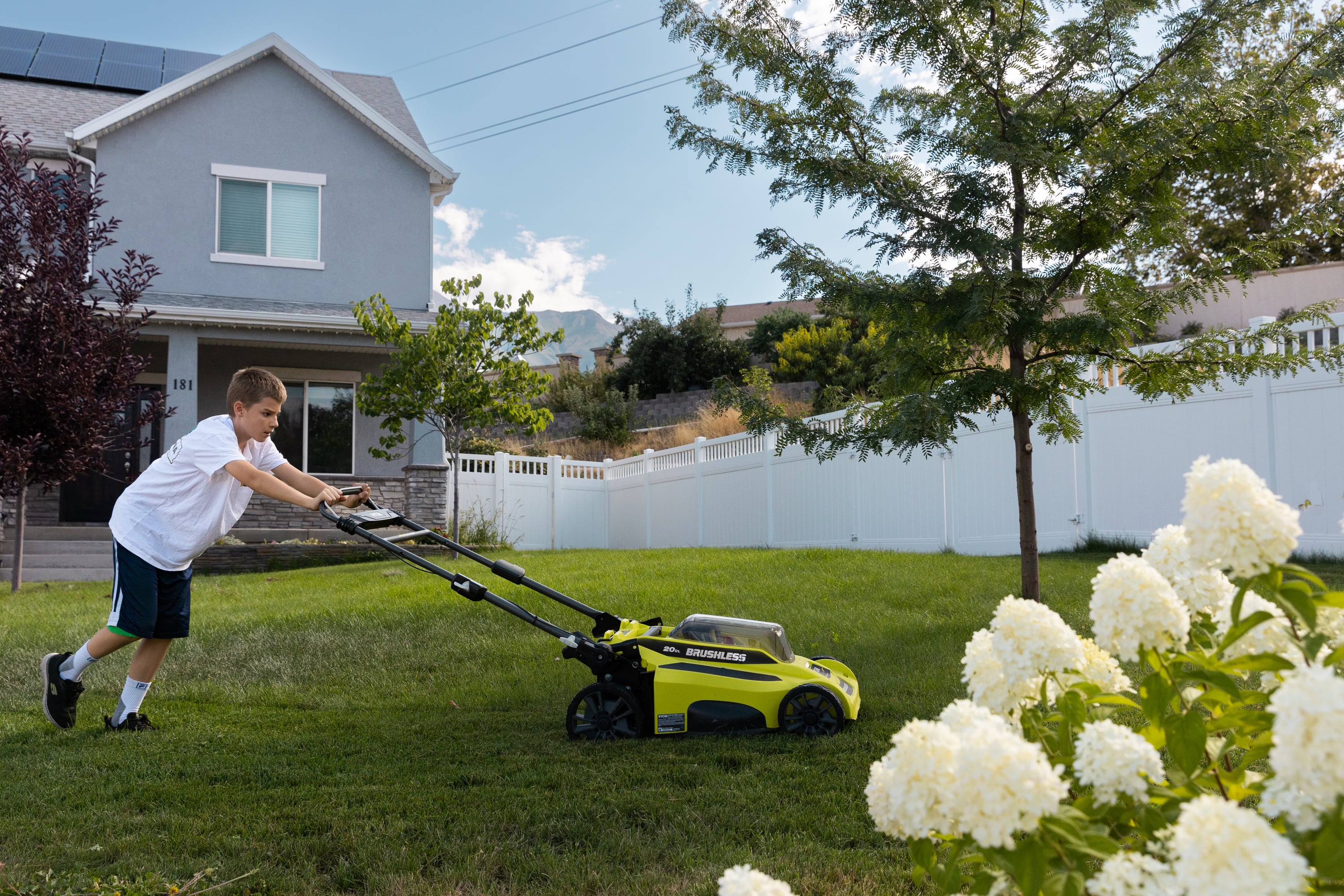 Justin Cox, 12, mows the lawn in front of his home in Lindon on Aug. 26, 2023. Experts say that weather change and an increase in airborne irritants is making the allergy season worse.