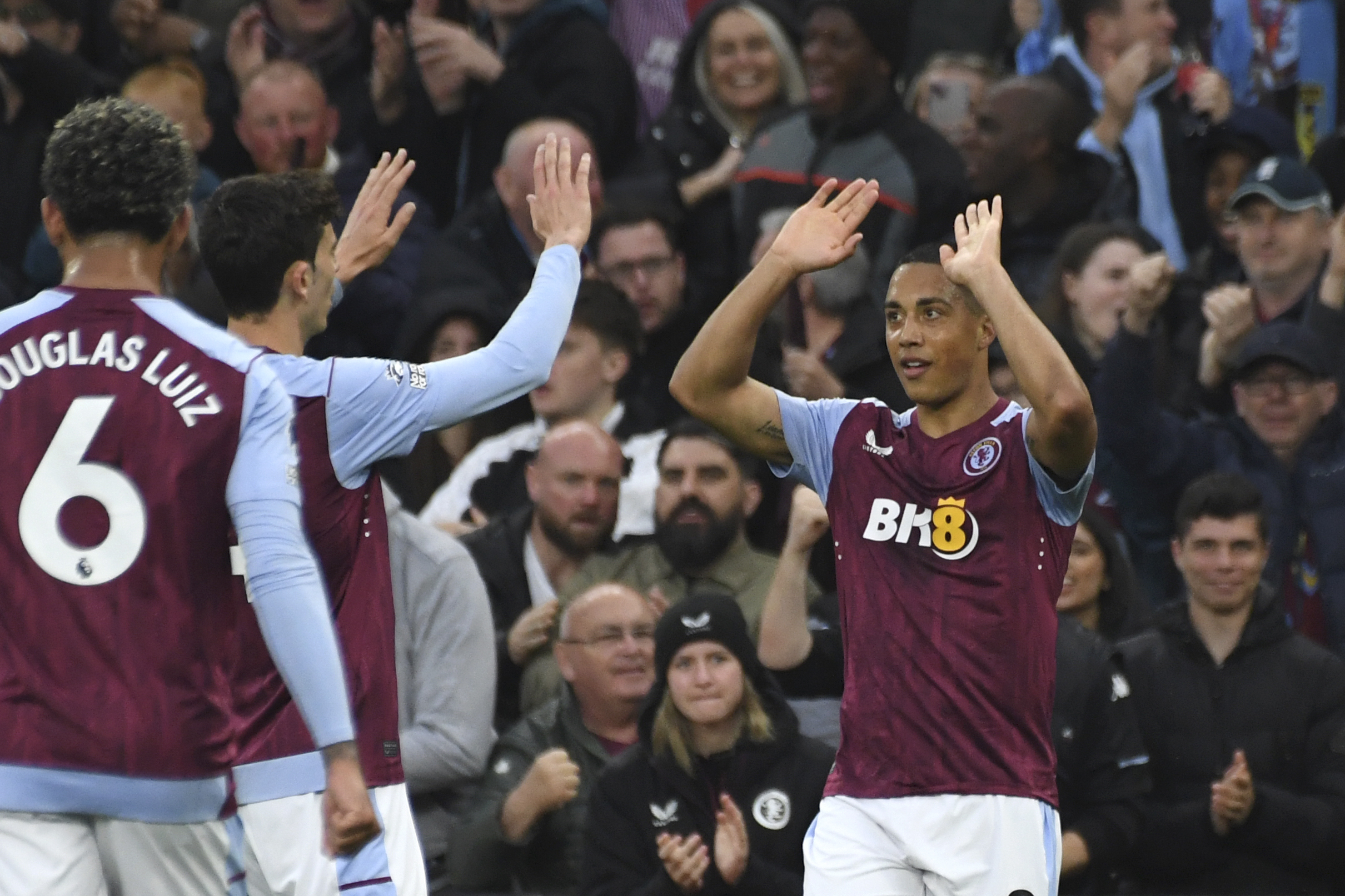 Aston Villa's Youri Tielemans, right, celebrates after scoring his side's opening goal during the English Premier League soccer match between Aston Villa and Liverpool at the Villa Park stadium in Birmingham, England, Monday, May 13, 2024.
