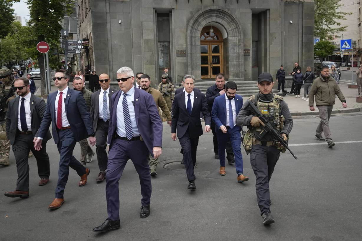 U.S. Secretary of State Antony Blinken, center, surrounded by security officers, walks in Independence Square in Kyiv, Ukraine, Tuesday. Blinken arrived in Kyiv on Tuesday in an unannounced diplomatic mission to reassure Ukraine that it has American support.