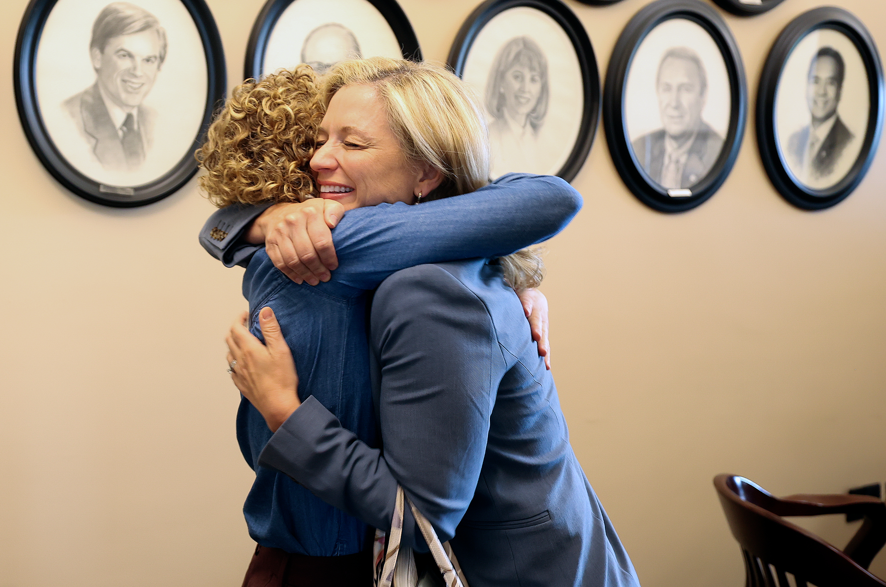 Utah Opioid Task Force director Natalie Boren hugs Melissa Holyoak, commissioner at the Federal Trade Commission, as they run into each other in the attorney general’s office at the Capitol in Salt Lake City on May 3.