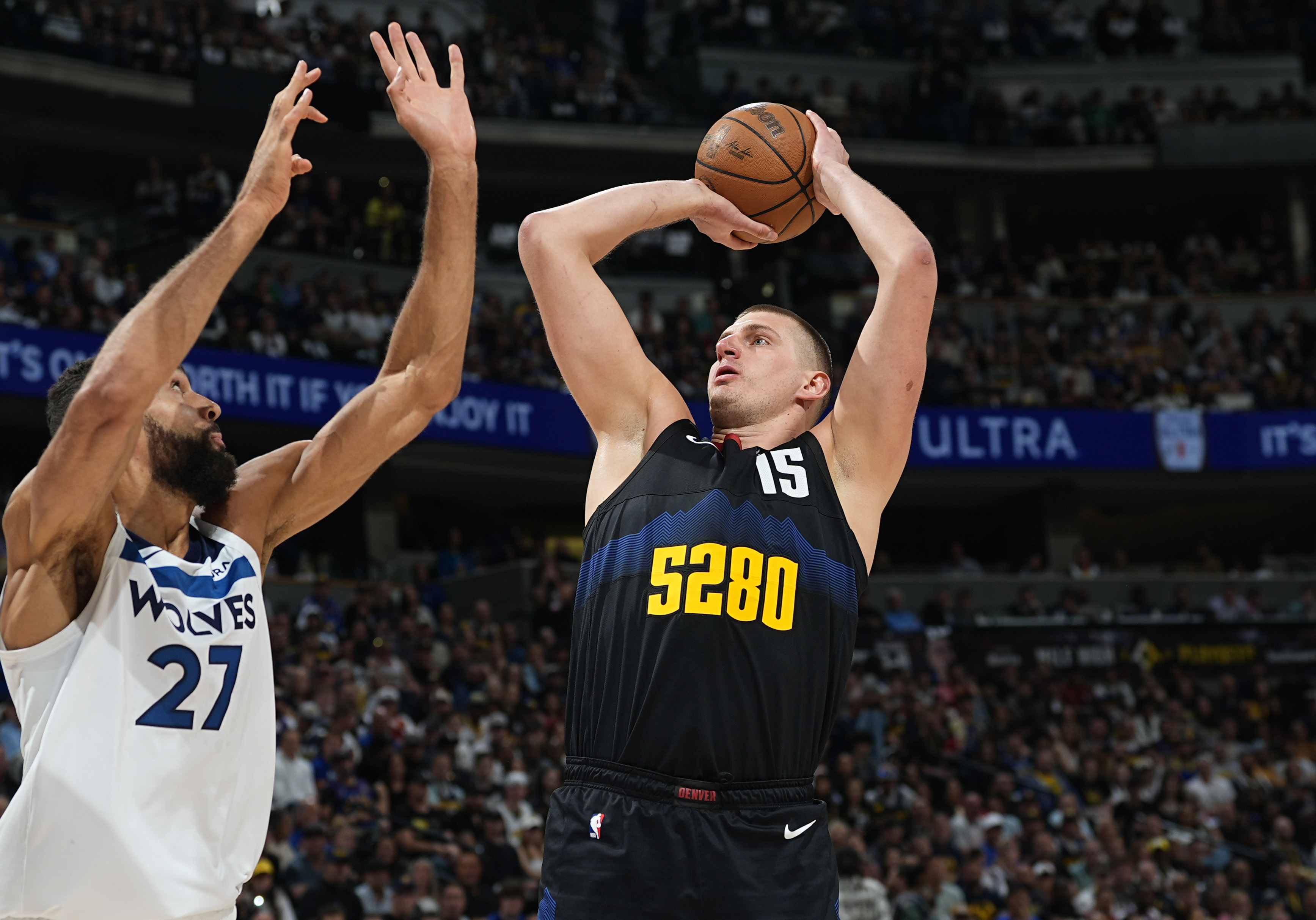 Denver Nuggets center Nikola Jokic shoots over Minnesota Timberwolves center Rudy Gobert during the first half of Game 5 of an NBA basketball second-round playoff series Tuesday, May 14, 2024, in Denver