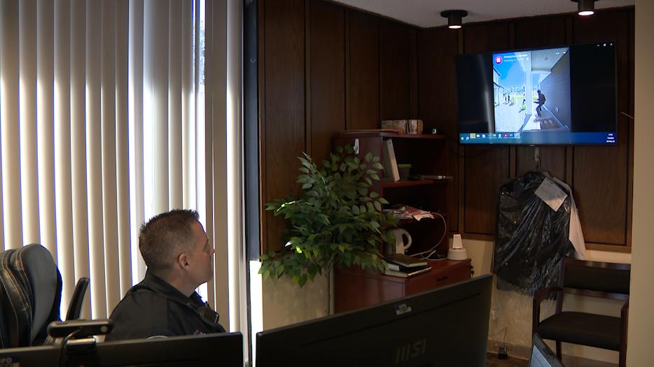 Unified Police Lt. Shane Manwaring watches a surveillance video showing suspected teen vandals in May.