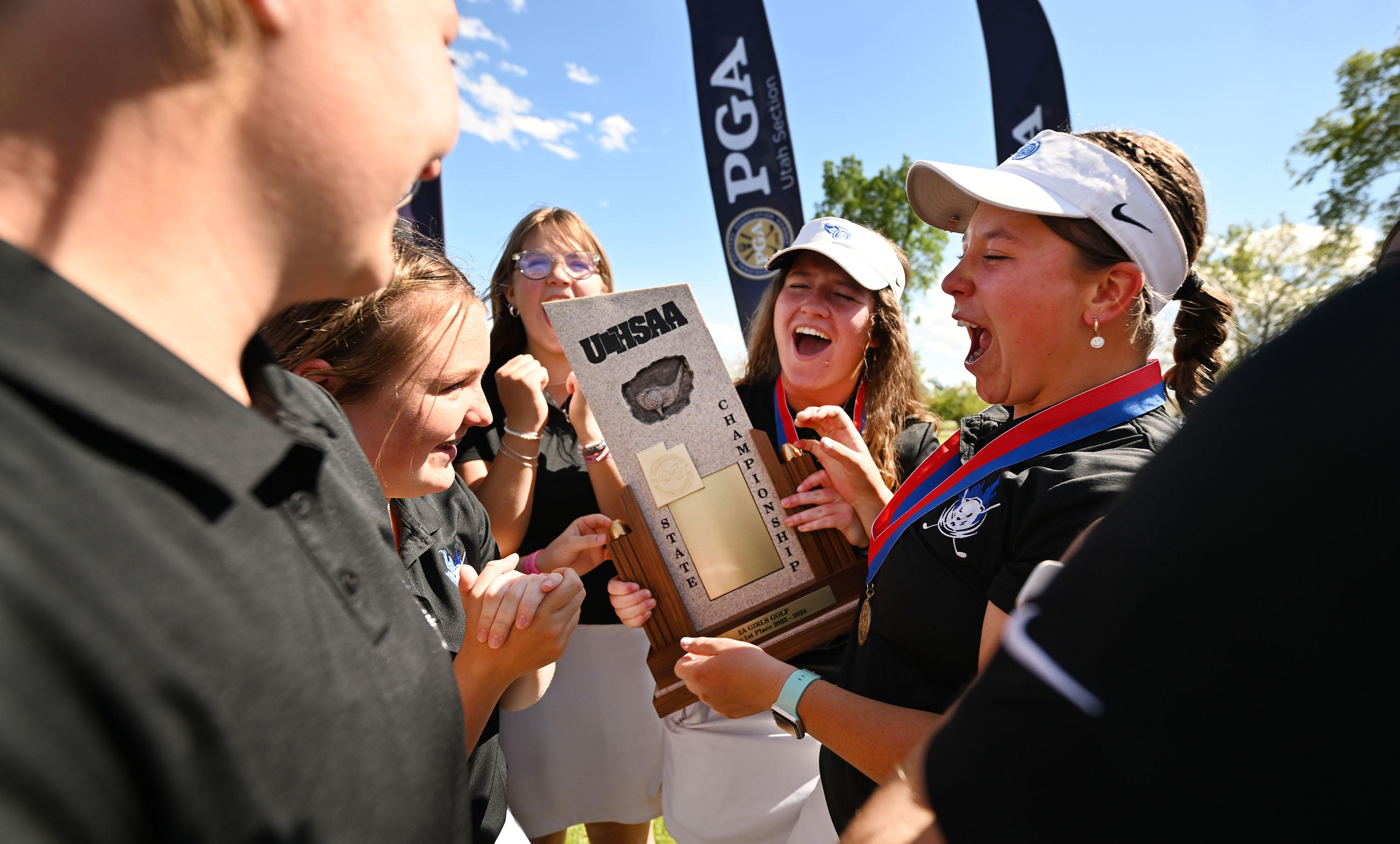 Members of Beaver High’s girls golf team celebrate their 2A state championship at Glendale Golf Course in Salt Lake City on Tuesday, May 14, 2024.