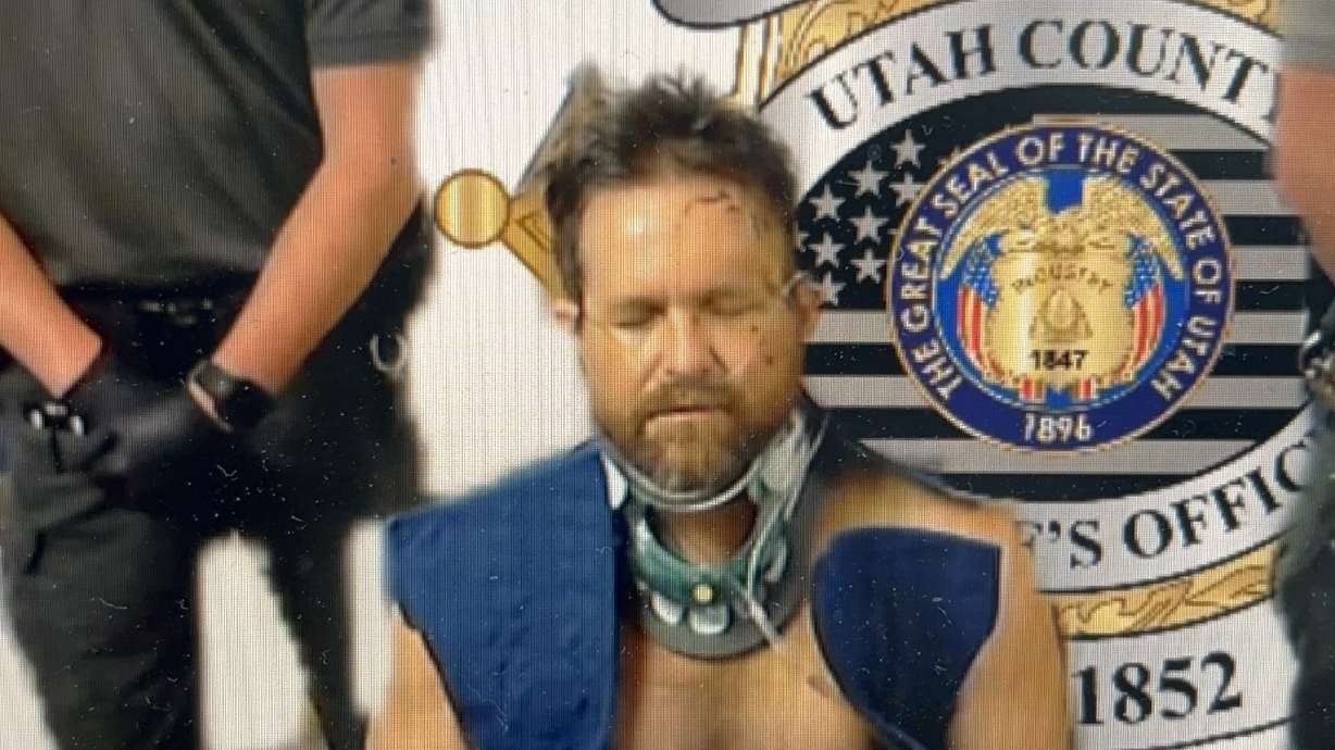 Michael Aaron Jayne appears in 4th District Court from a wheelchair at the Utah County Jail on Wednesday on charges of killing a Santaquin police sergeant.