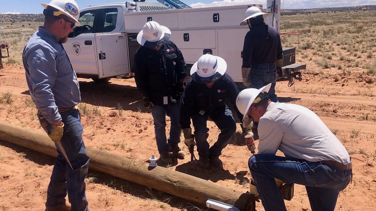 Members of the Provo Power crew help with an electrification effort in the Navajo Nation on Monday.