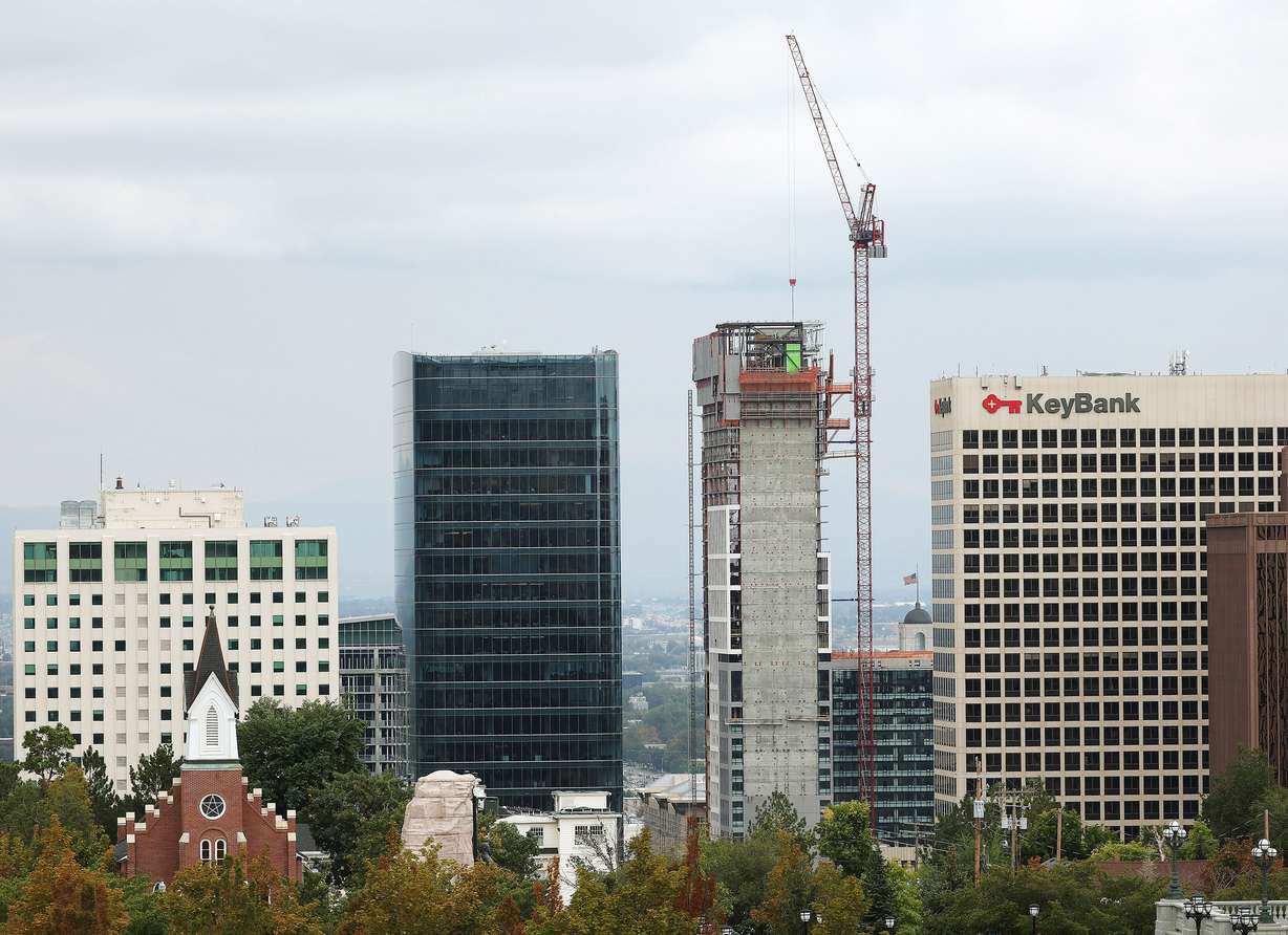 Building construction continues with a crane in downtown Salt Lake City on Oct. 3, 2023.