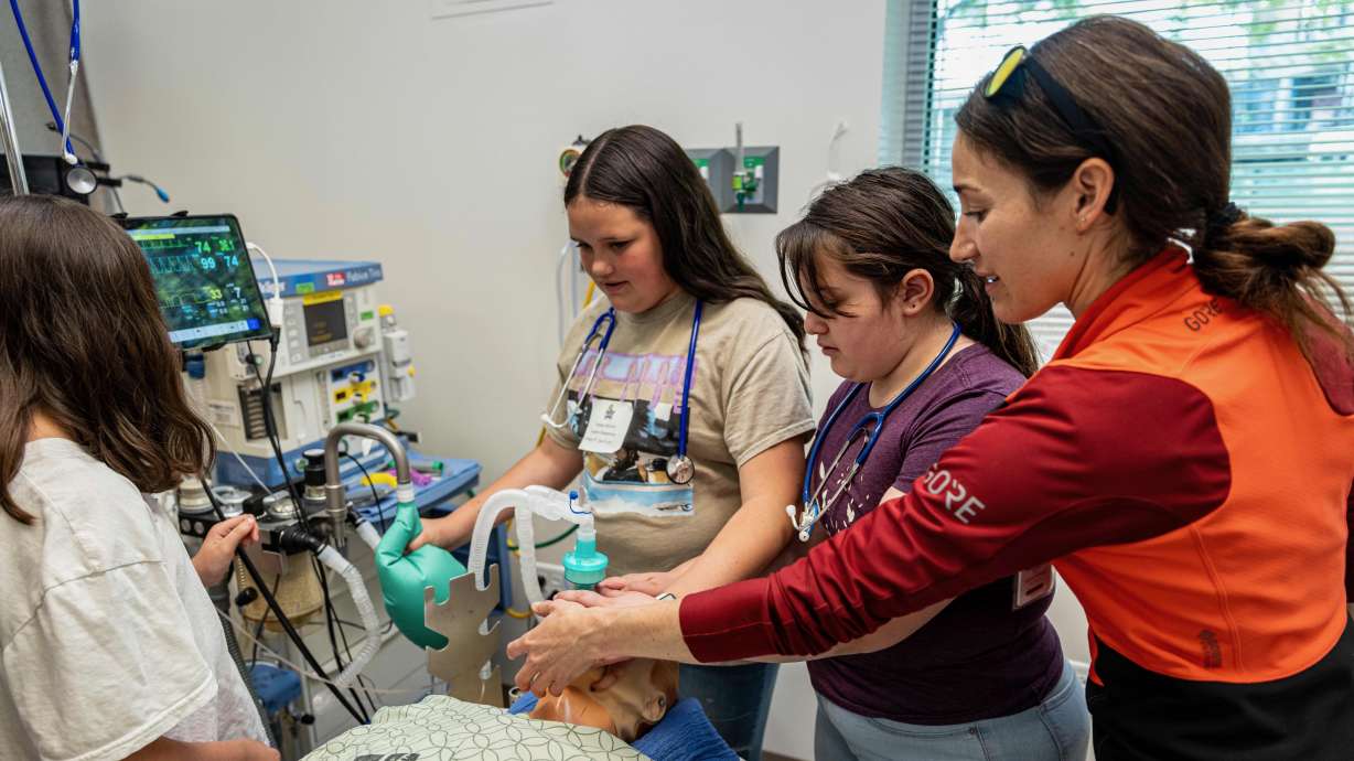 Dr. Rachel Danowit works with students taking part in Imagine U Day on Wednesday at the University of Utah Health campus in Salt Lake City.